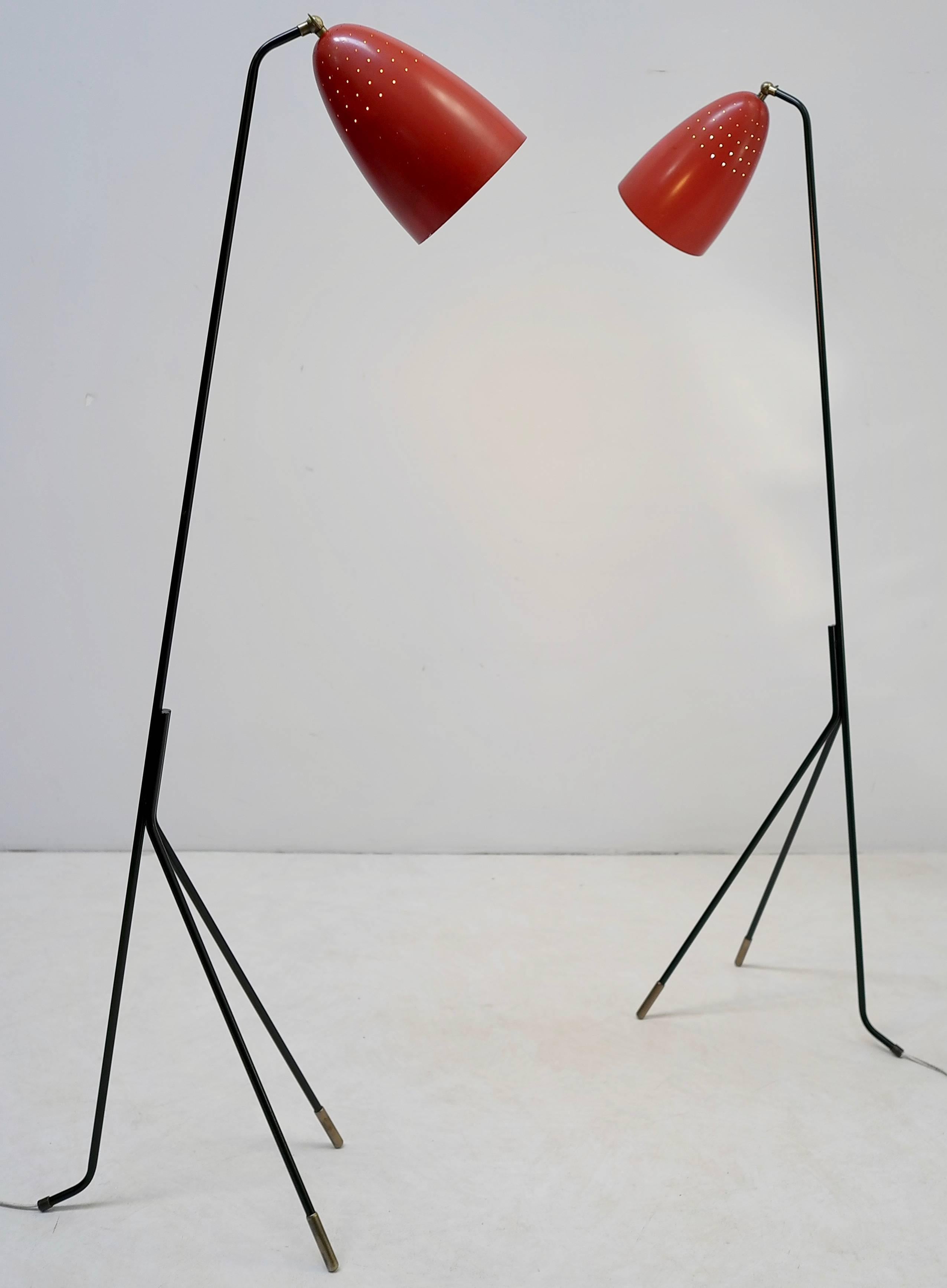 Red grasshopper floor lamp by Svend Aage Holm Sorensen, Denmark, 1950s.

Beautiful light shines through the many tiny holes in the red hoods. The ends from the metal bases are made from brass. We have two of these lamps available. 