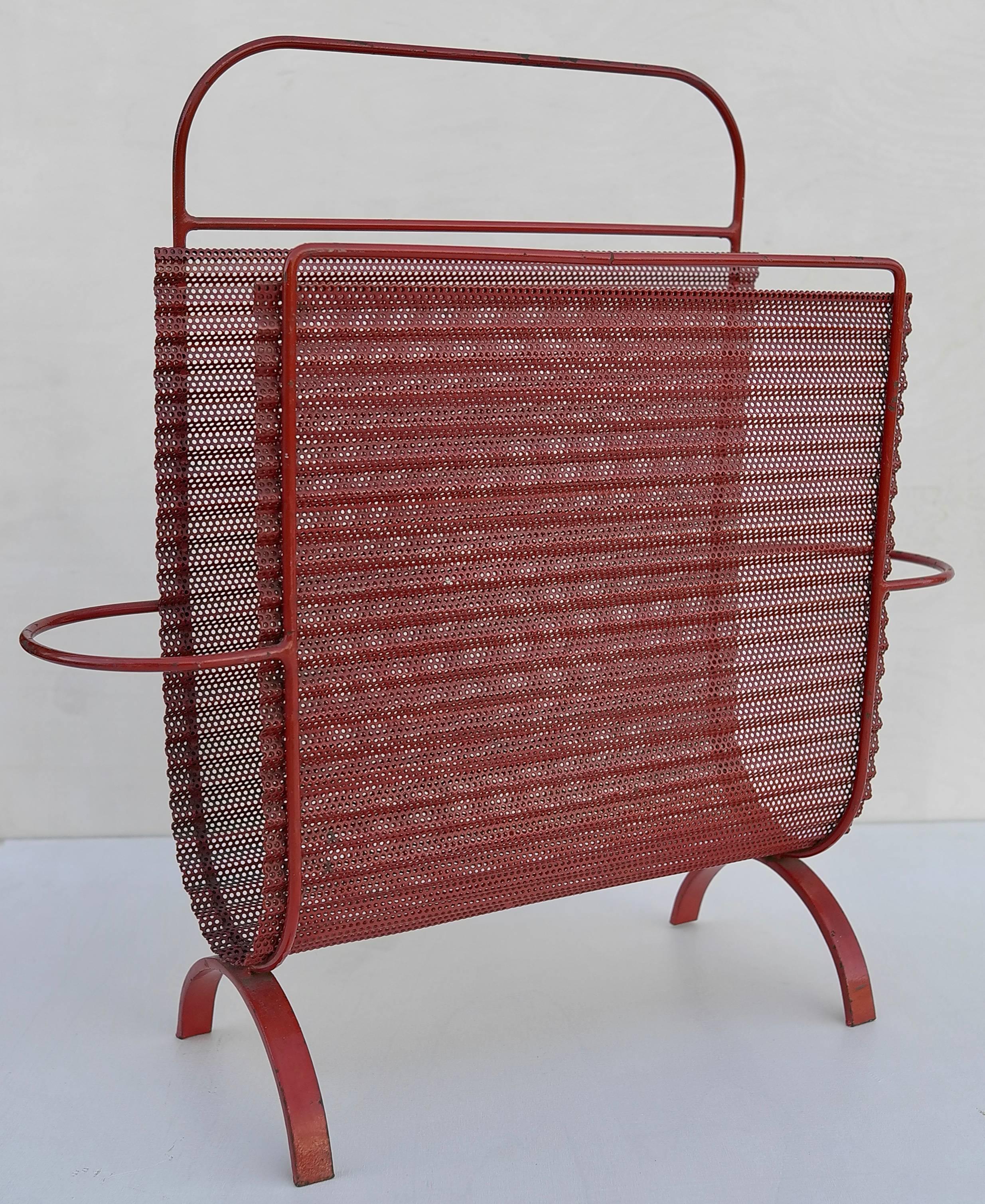 Magazine holder, model Harpers, designed by Mathieu Matégot, rare in red metal. Manufactured by Ateliers Matégot, circa 1950. Folded, perforated metal.