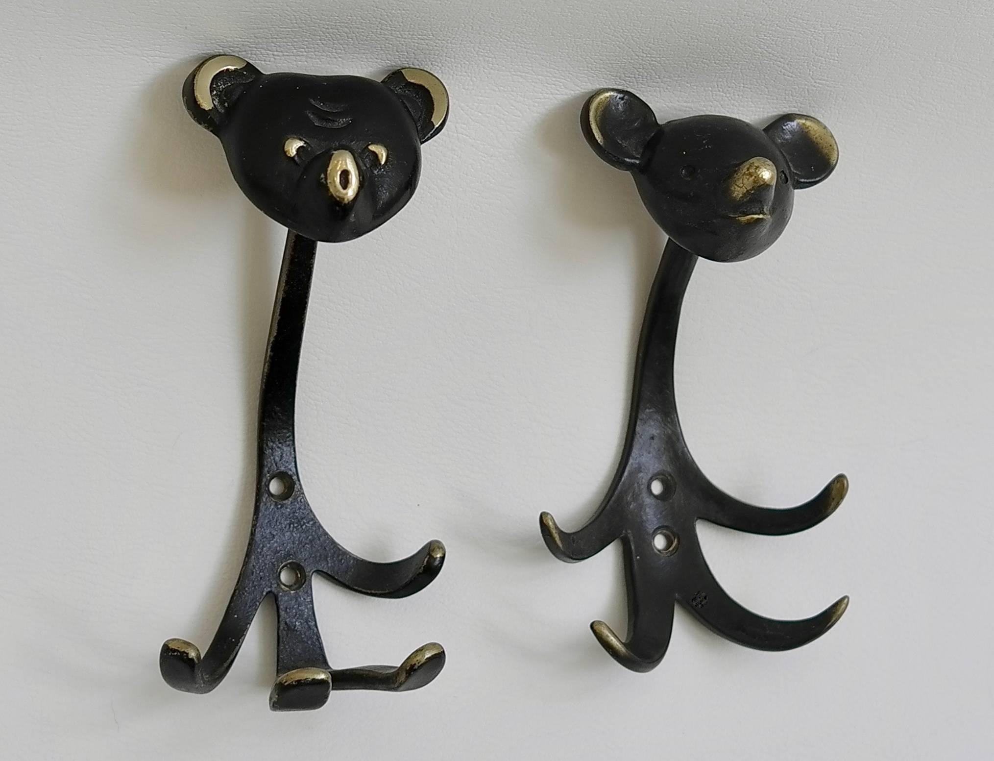 Two Walter Bosse brass wall hooks of a bear, Austria 1950s.