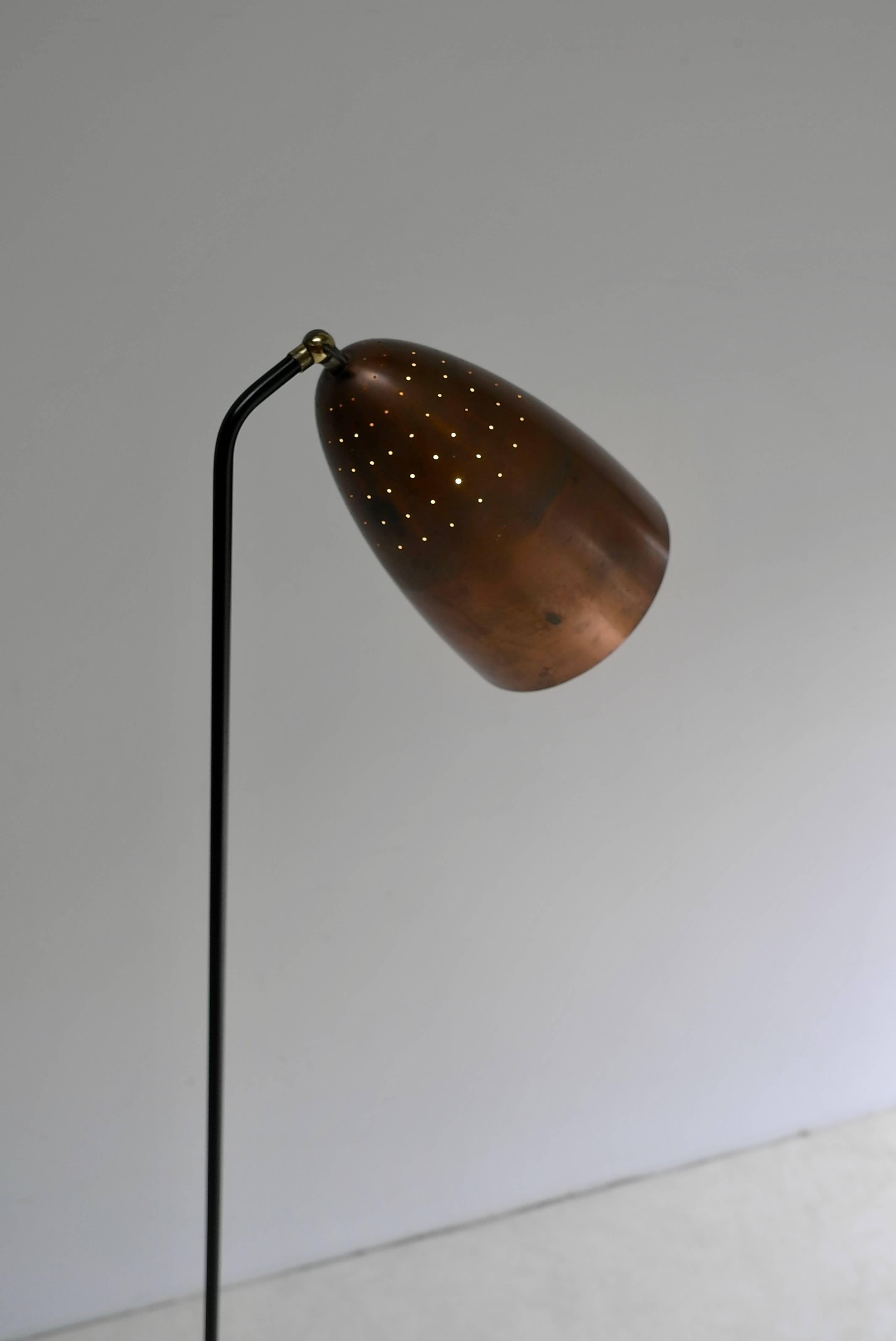 Rare copper grasshopper floor lamp by Svend Aage Holm Sorensen, Denmark, 1950s. Beautiful light shines through the many tiny holes in the copper hood. The ends from the metal base are made from brass.