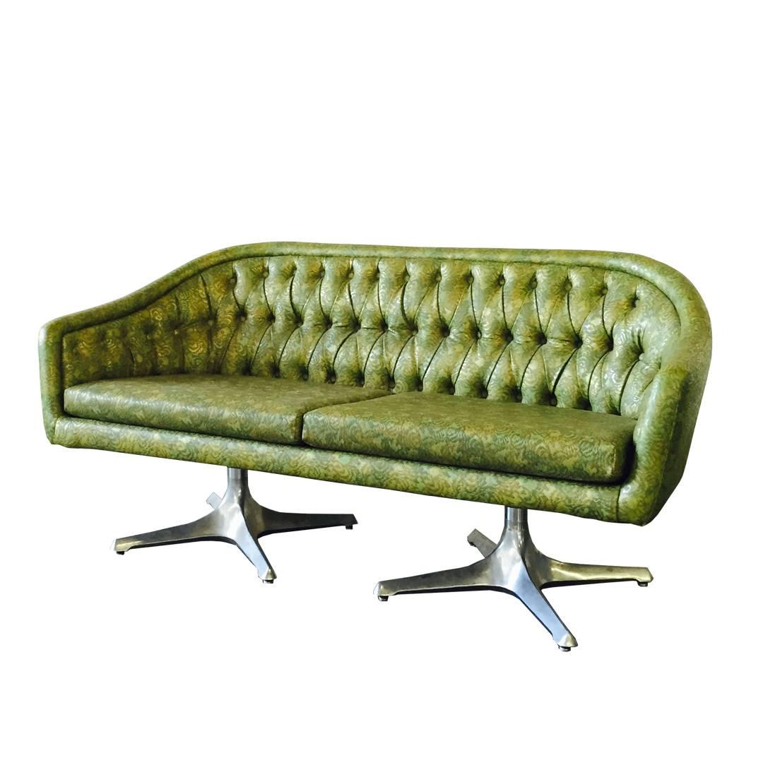 This loveseat retains original vinyl upholstery with propeller pedestal base, circa 1960s.

Dimensions: 59