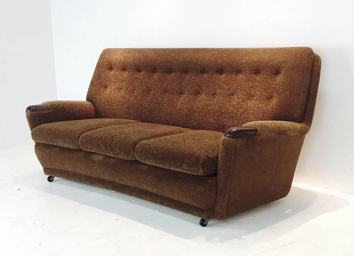 Vintage Italian brown mohair sofa on casters. There is some visible wear and new upholstery is recommended.

dimensions: 72" W x 33" D x34" T
seat height 15".