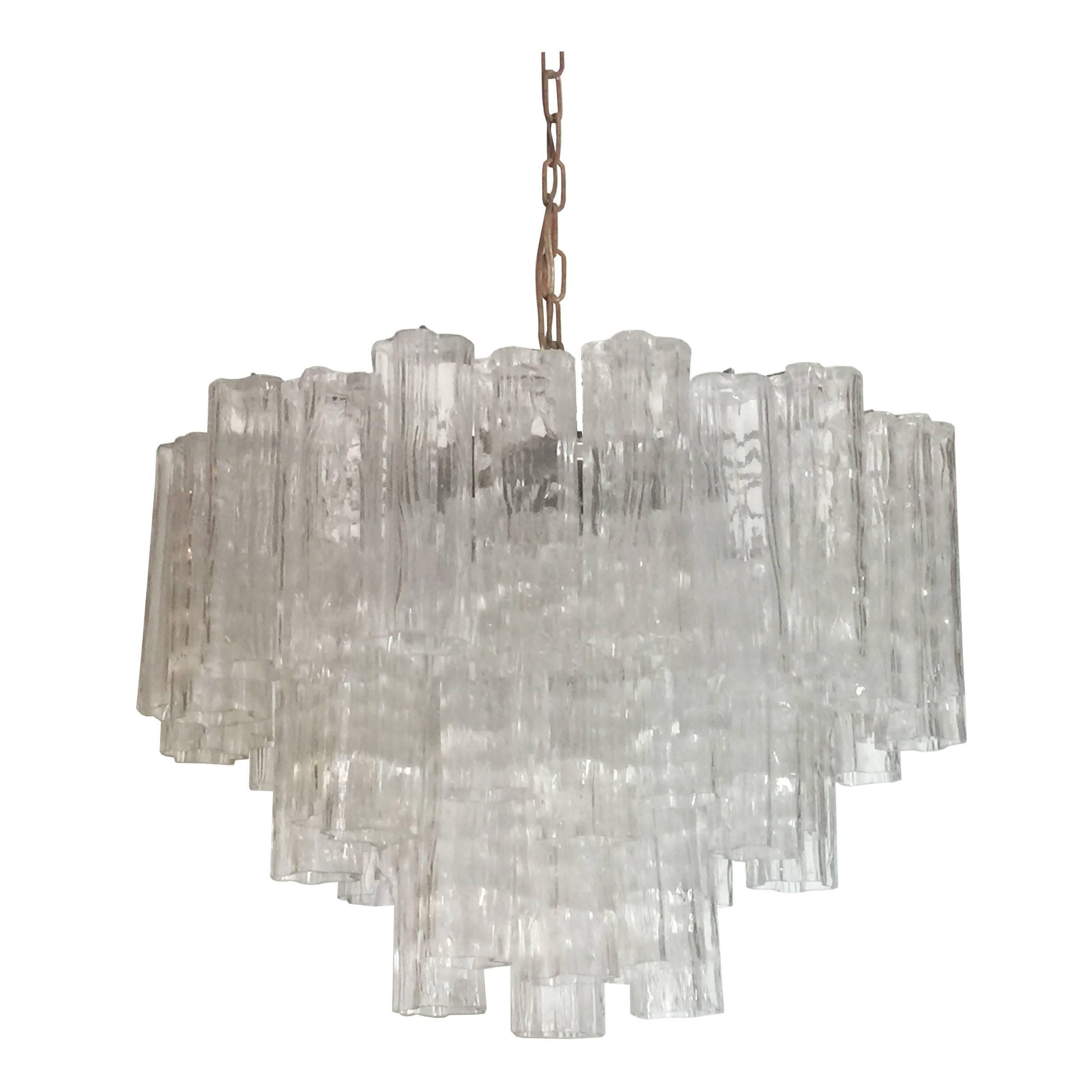 Three-tier Murano glass chandelier. 

Dimensions: 24" dia x 18" T.