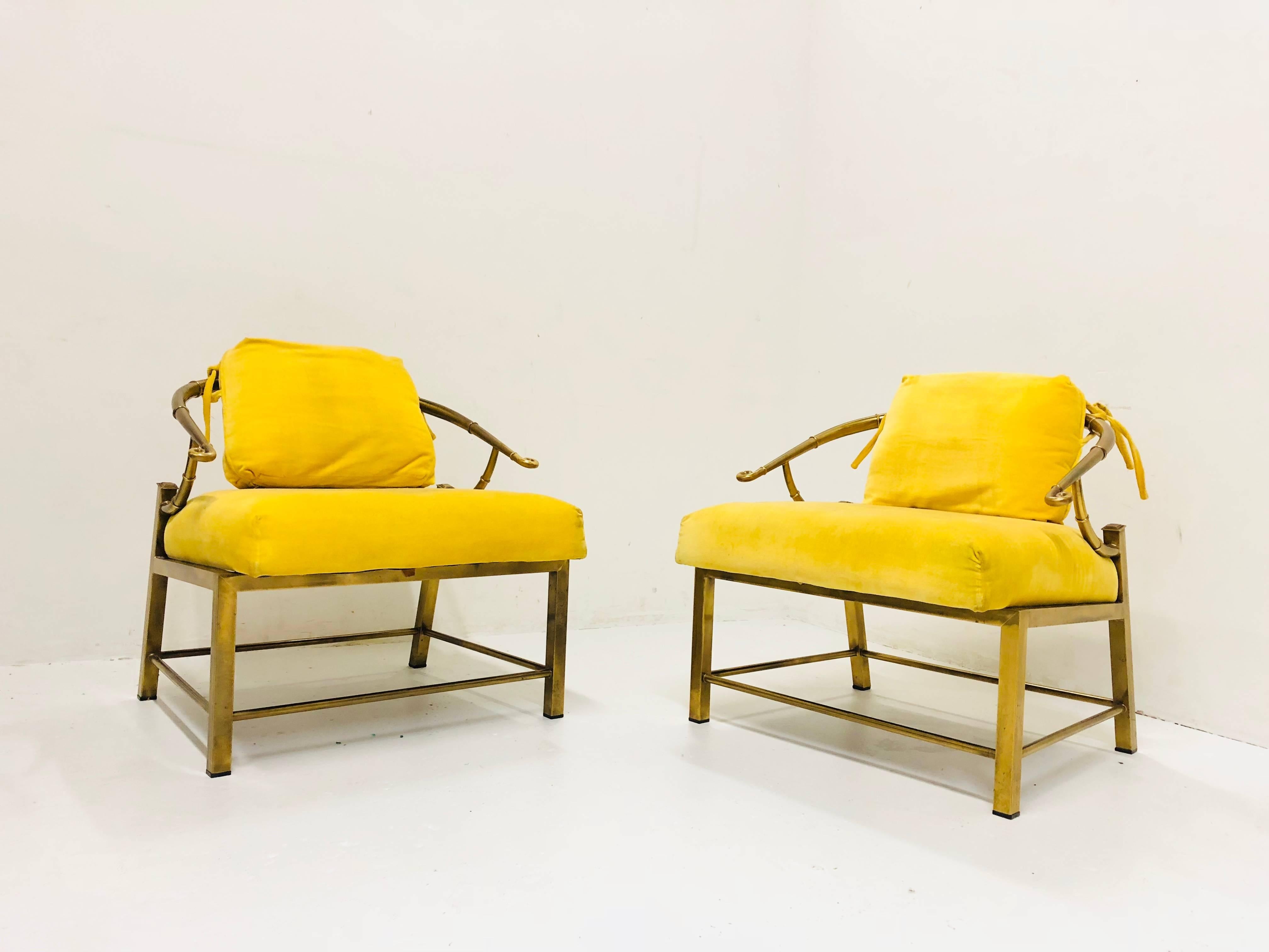 Pair of brass Ming lounge chairs with yellow velvet. New upholstery and refinishing is recommended, circa 1960s.

Dimensions: 26