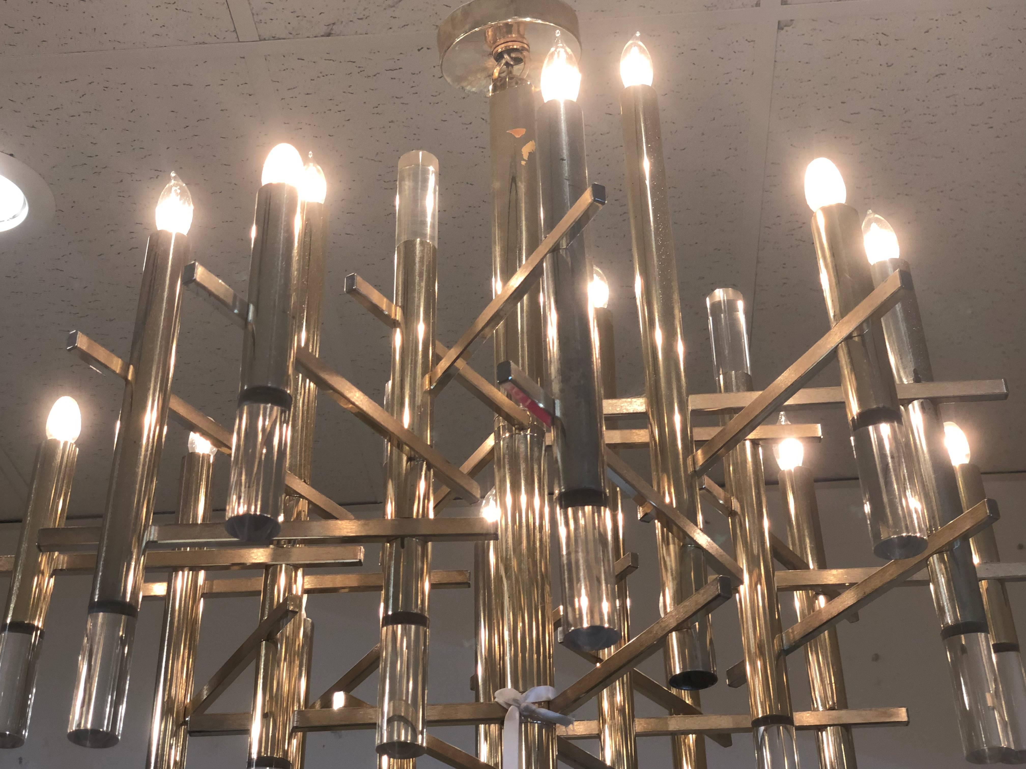 Fifteen-light Sciolari chandelier with brass accents. Minor pitting on brass finish with one Lucite rod missing.

Dimensions: 23