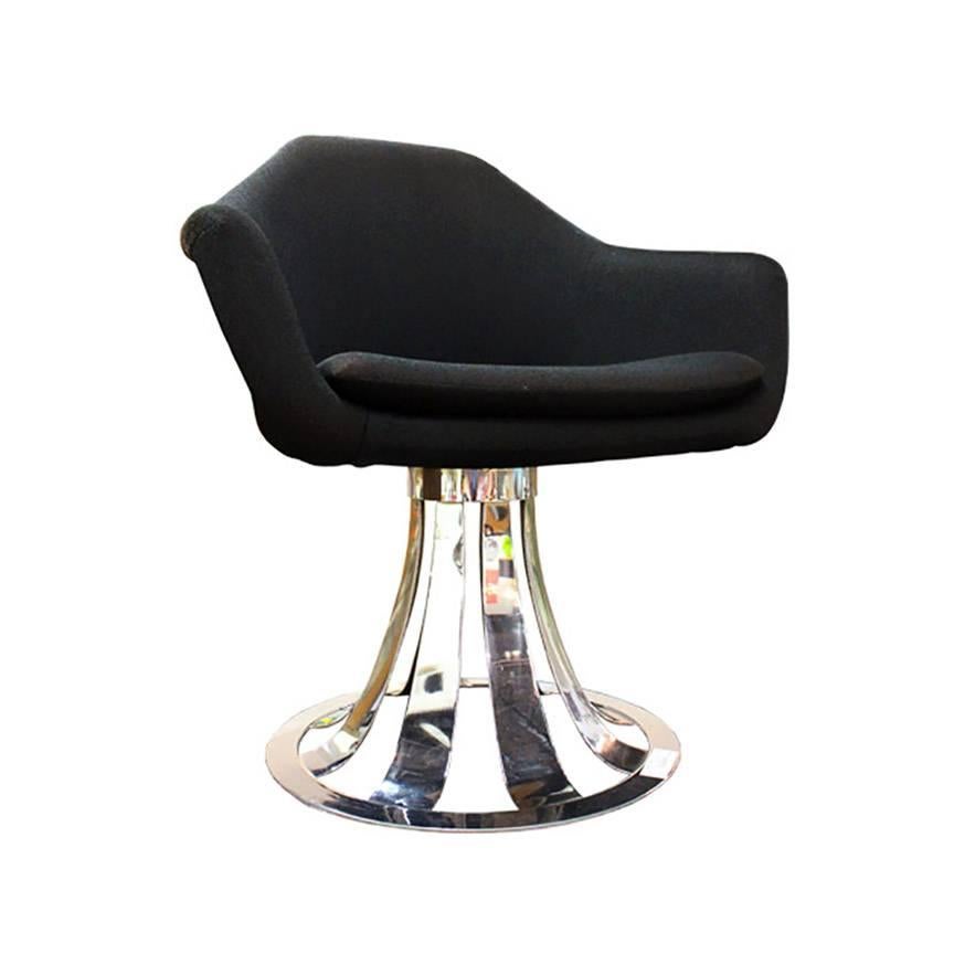 Modern Chrome Swivel Chair. Can be used as a desk. (8 Chairs are available)

The chairs are fiberglass wrapped upholstery, fabric is a loose on chairs like a form fitting slipcover, and new upholstery is recommended. There are minor surface