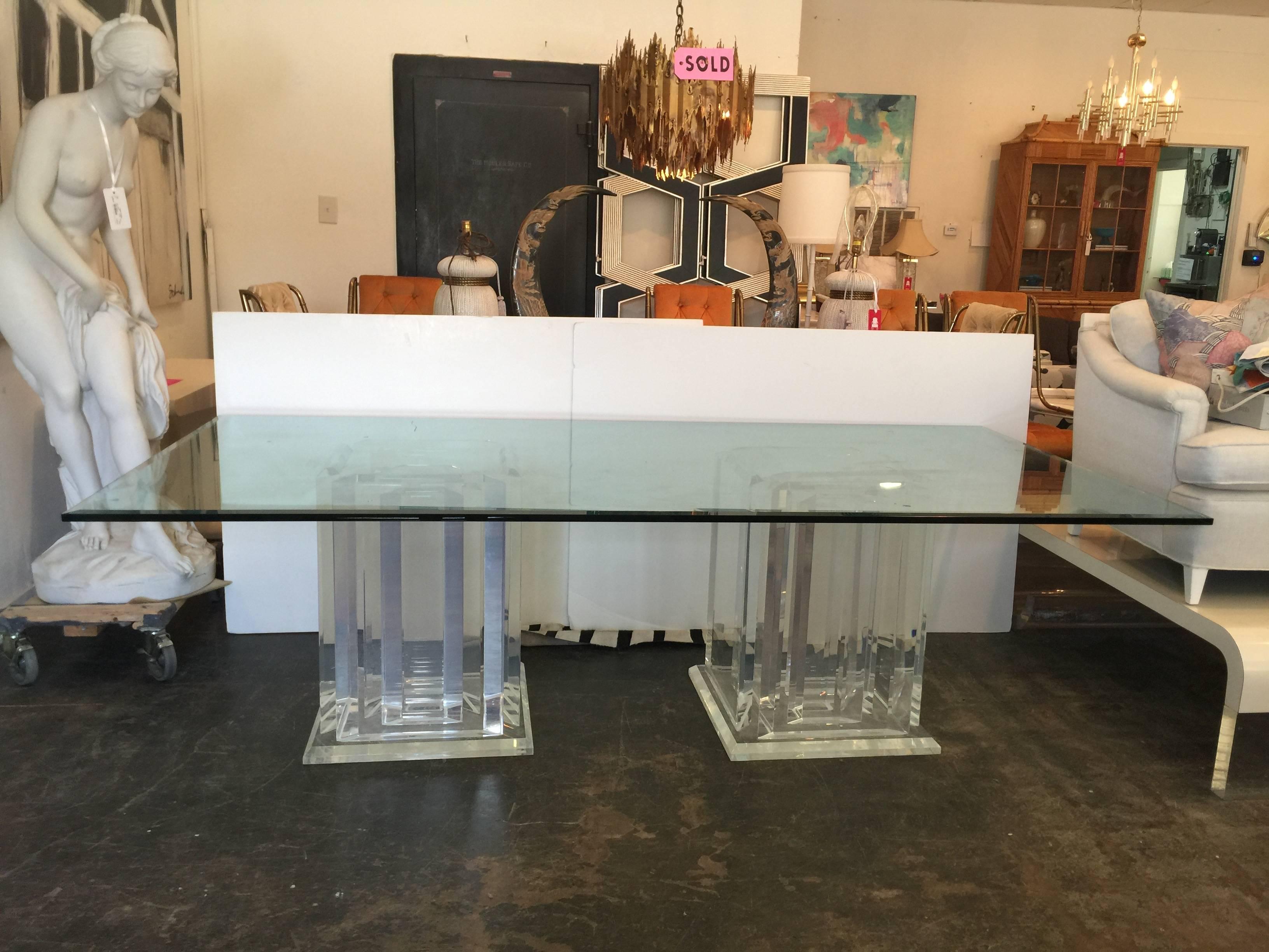 Pair of Lucite pedestals and glass dining table. 3/4