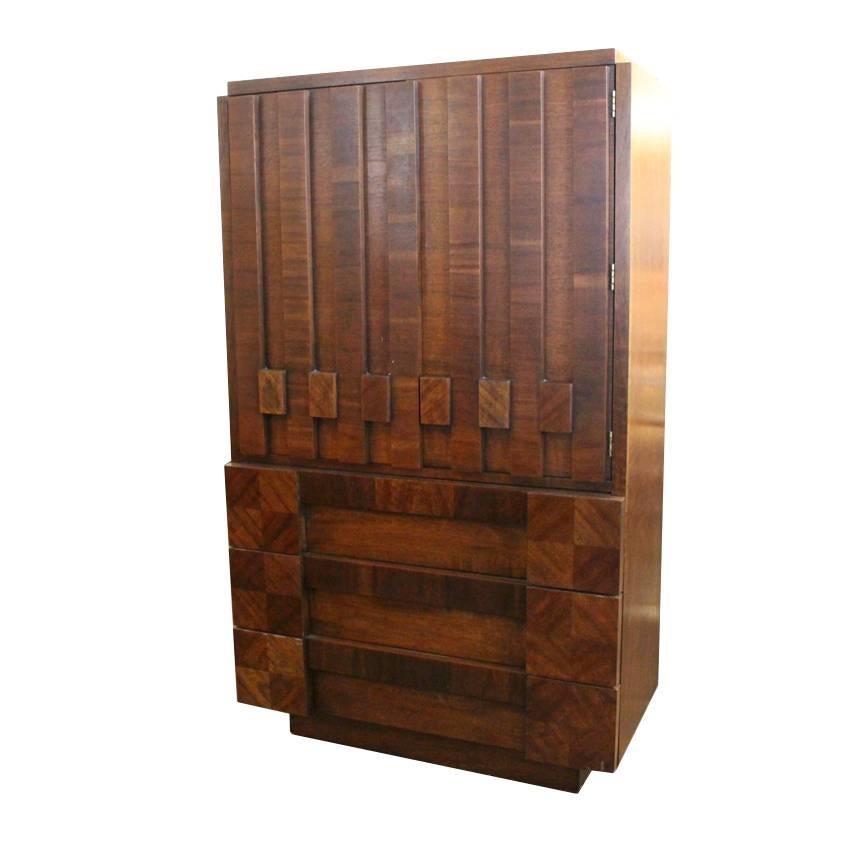1970s, Brutalist cabinet by Lane. Cabinet has three bottom drawers and upper shelving.

Dimensions: 38.5