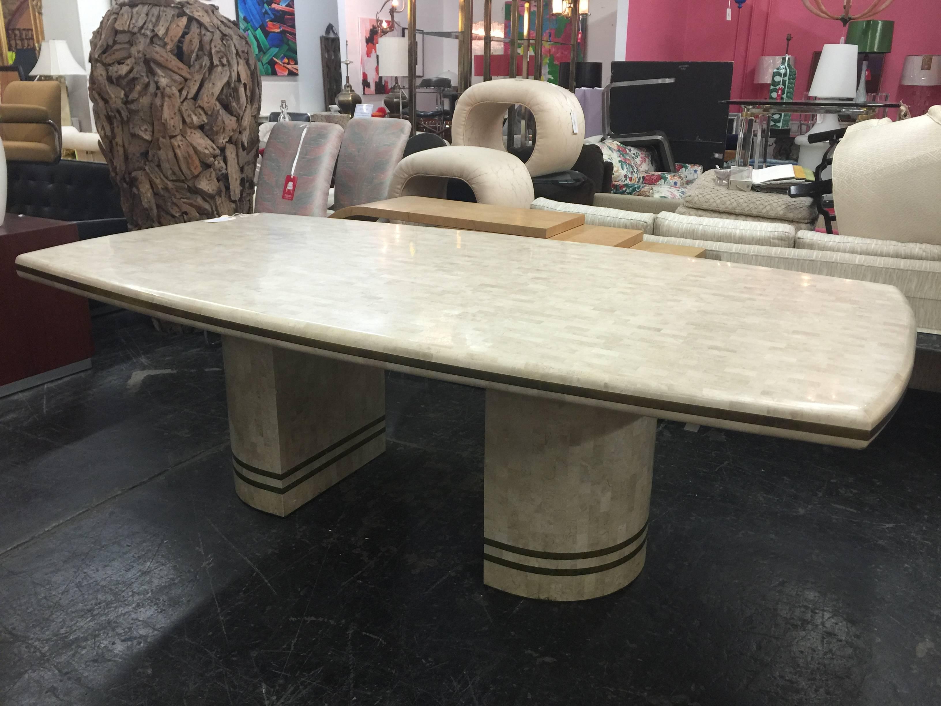 Tessellated marble and brass dining table.

Dimensions: 89