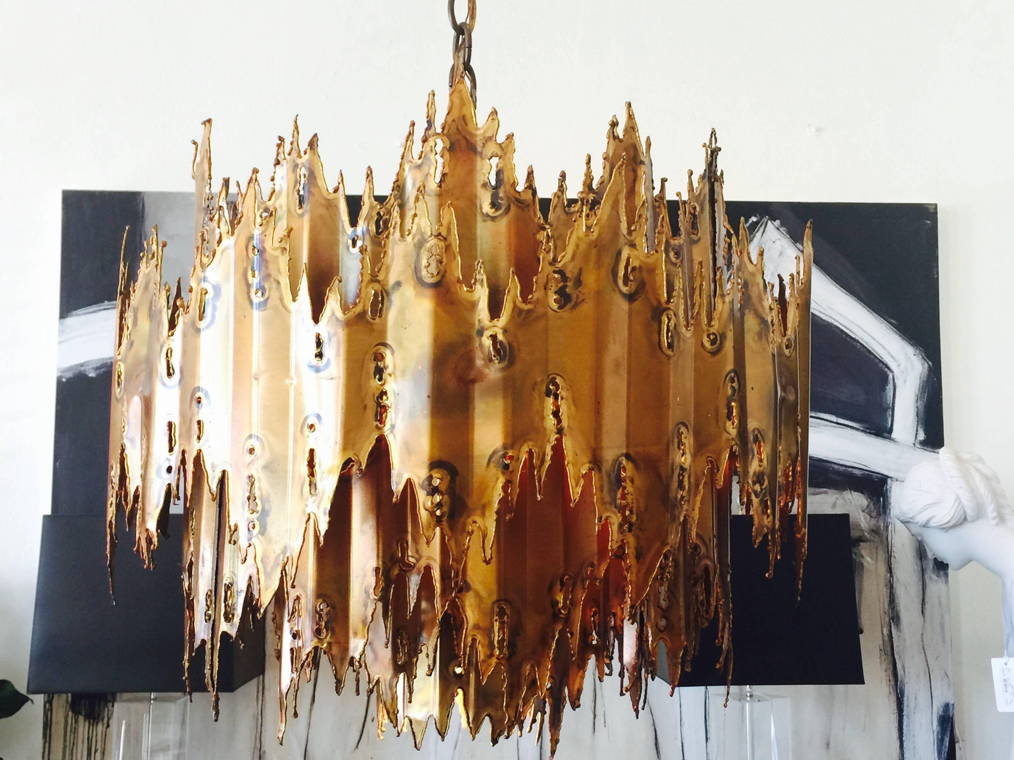 Torch cut and patinated brass chandelier by Tom Greene for Feldman. Six 