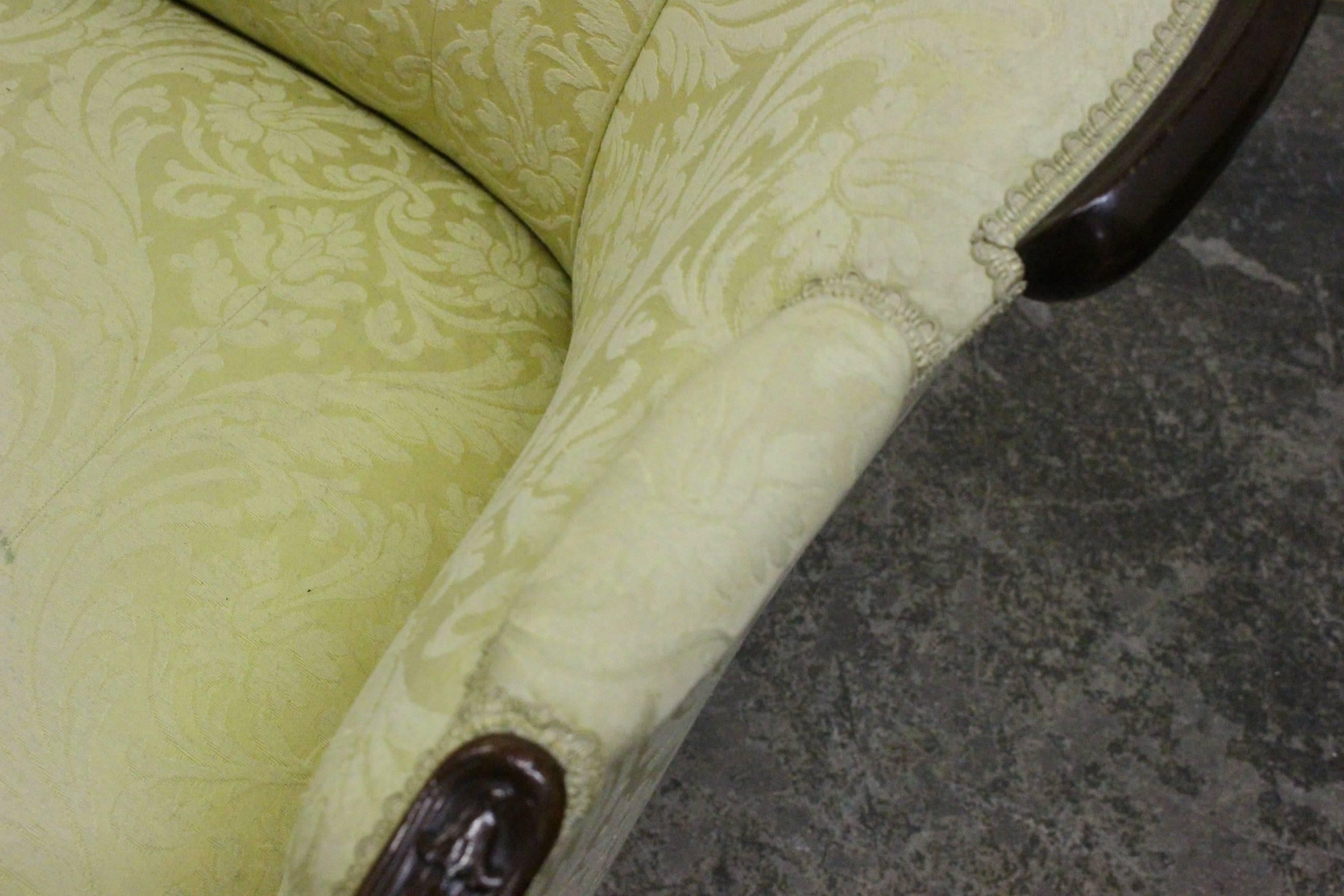 Wood wrapped French sofa upholstered in a yellow damask. 

Dimensions: 77