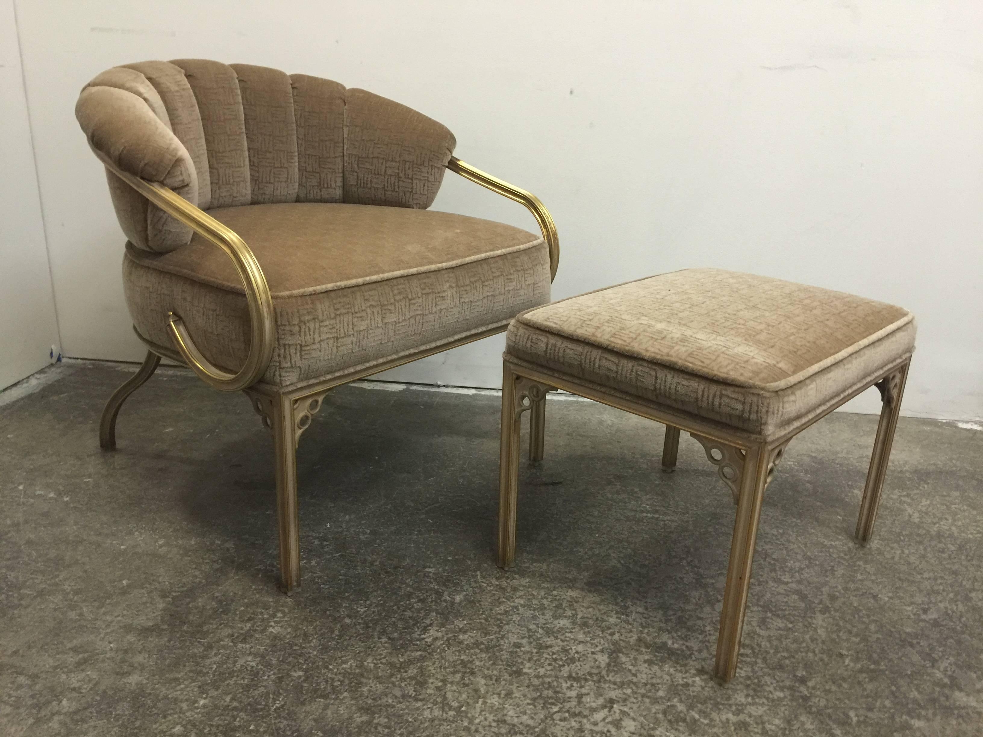 Graceful scrolled arm brass chair and ottoman with mohair upholstery. 

Dimensions: 28" W x 27" D x 29" T,
seat height 18".
22" W x 17" D x 15" T ottoman.
 