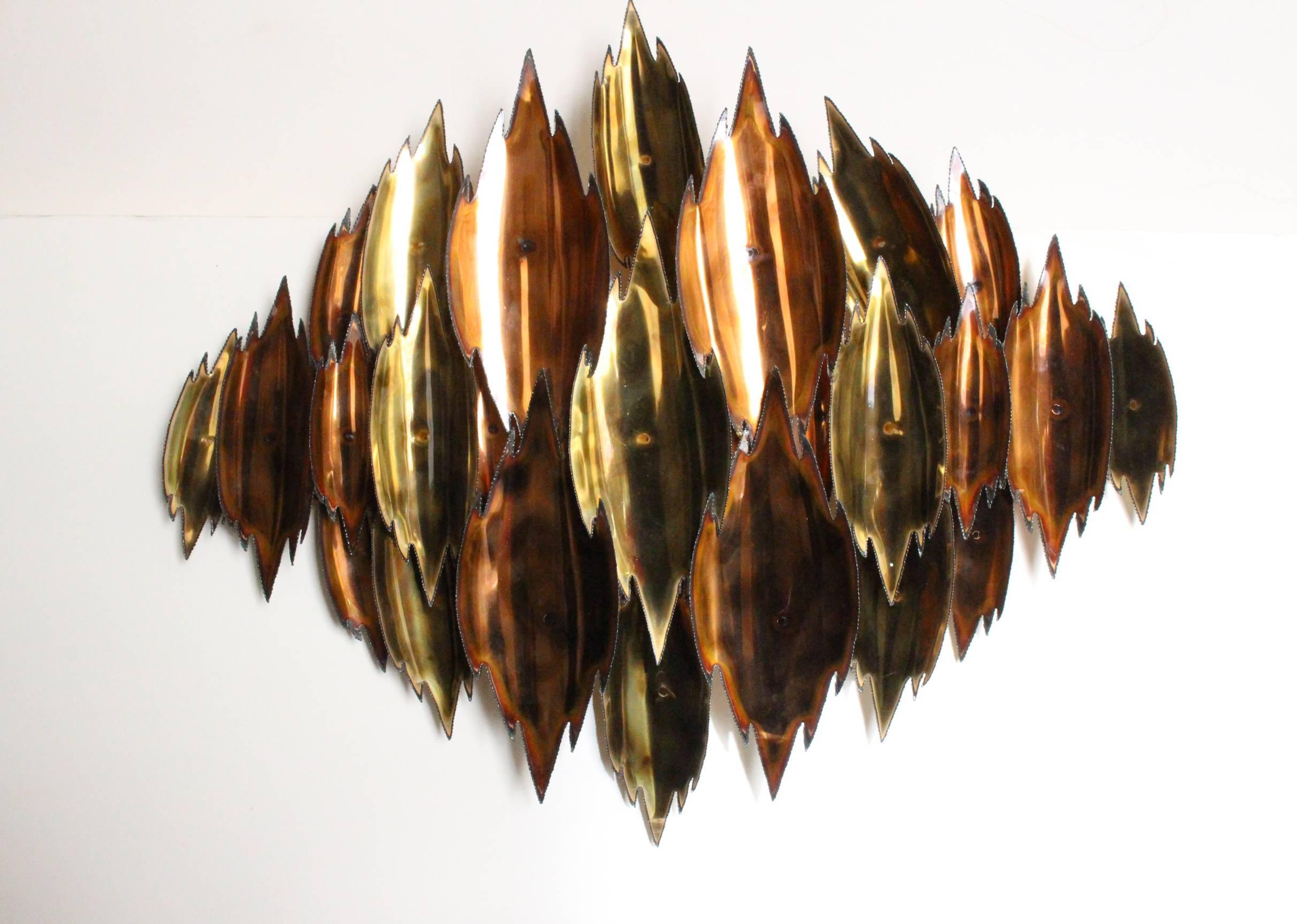 1970s brass and copper Brutalist wall sculpture.

Dimensions: 38