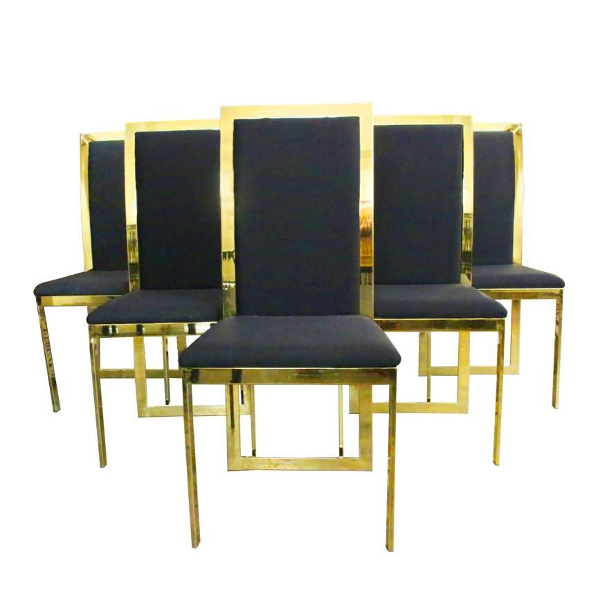 Set of six brass dining chairs in the style of Milo Baughman.

Dimensions: 17