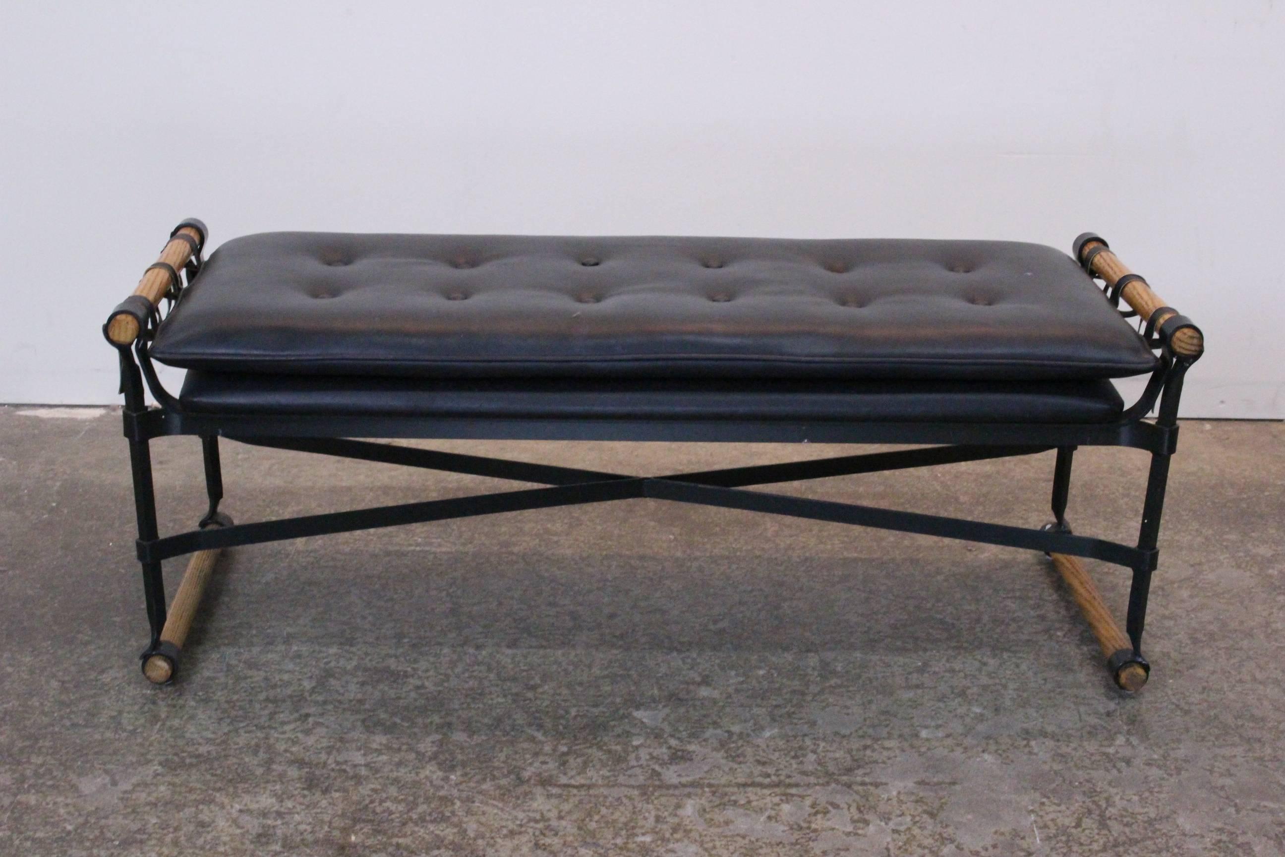 Pair of faux leather Campaign benches by Cleo Baldon. Wrought iron frames with oak stretchers.

Dimensions: 47