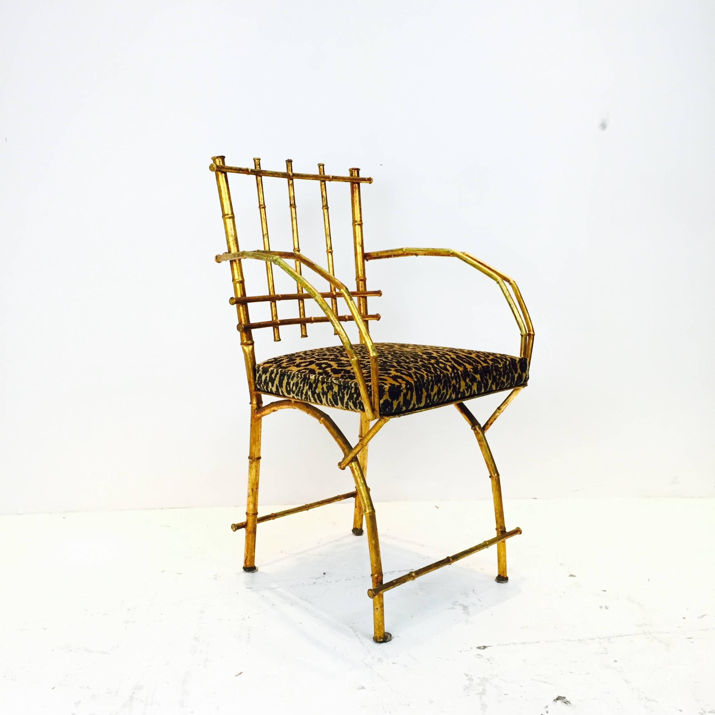 Gold leaf faux bamboo vanity chair.

Dimensions: 20.5" W x 18" D x 33" T,
seat height 18".
