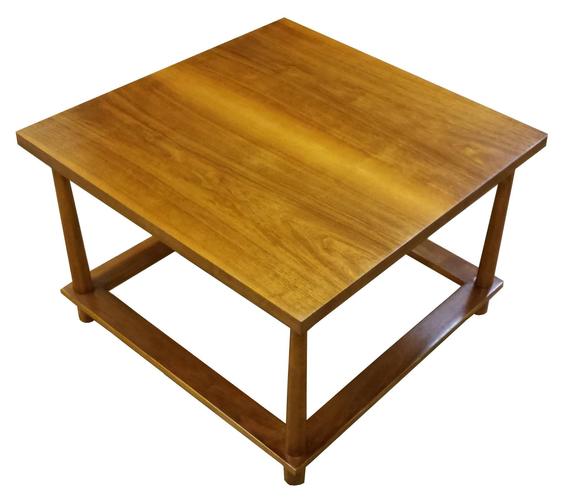 T.H. Robsjohn-Gibbings for Widdicomb side table in claro walnut. Very rare table with reverse tapered legs. Has been professionally restored and is in excellent condition. Matching coffee table is also available.