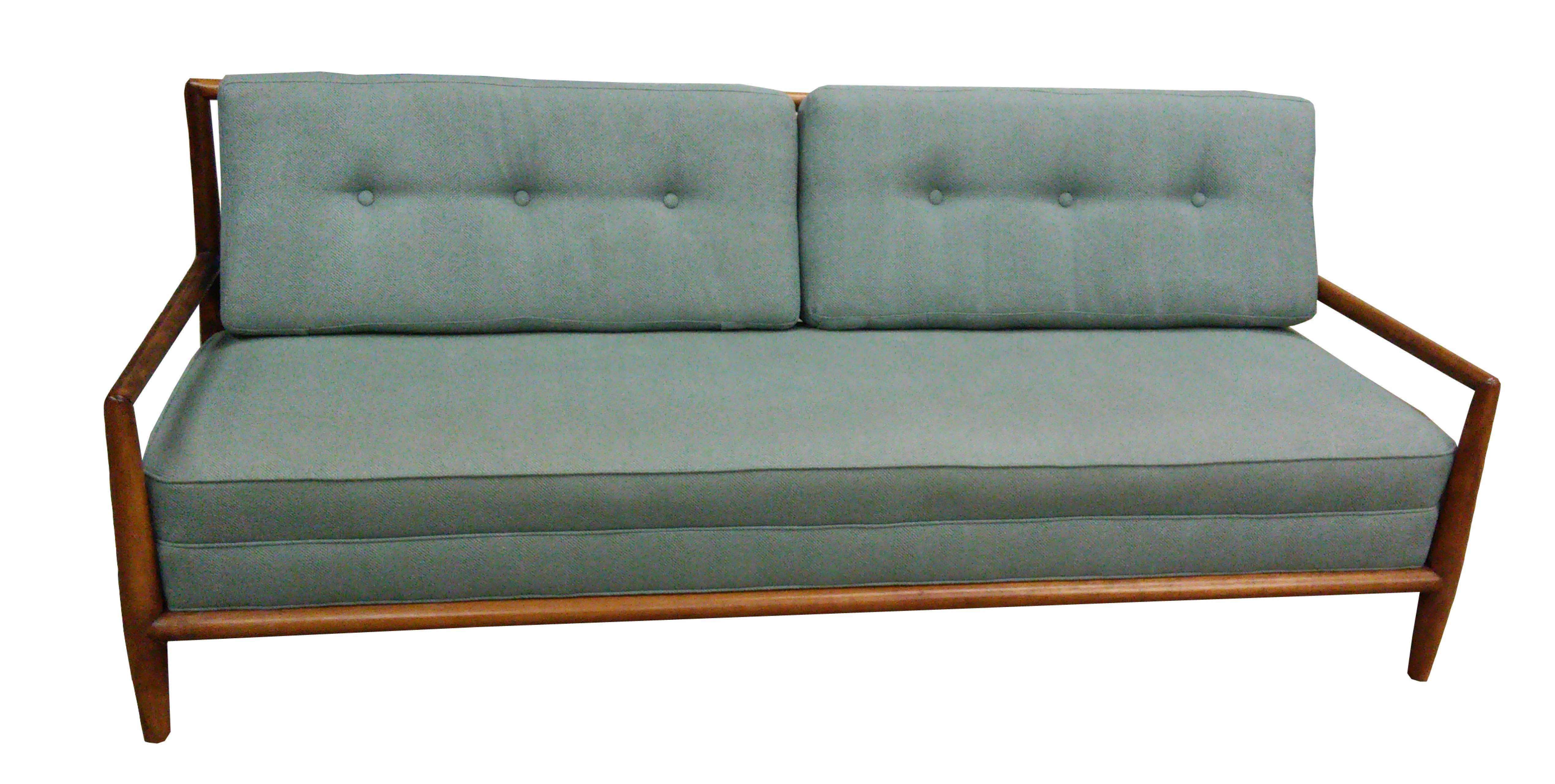Long couch designed by T.H. Robsjohn-Gibbings for Widdicomb, circa 1950. New upholstery and cushions. Solid Clara walnut wraparound frame with solid walnut slats in back. Has been professionally restored and is in excellent condition. Pair of