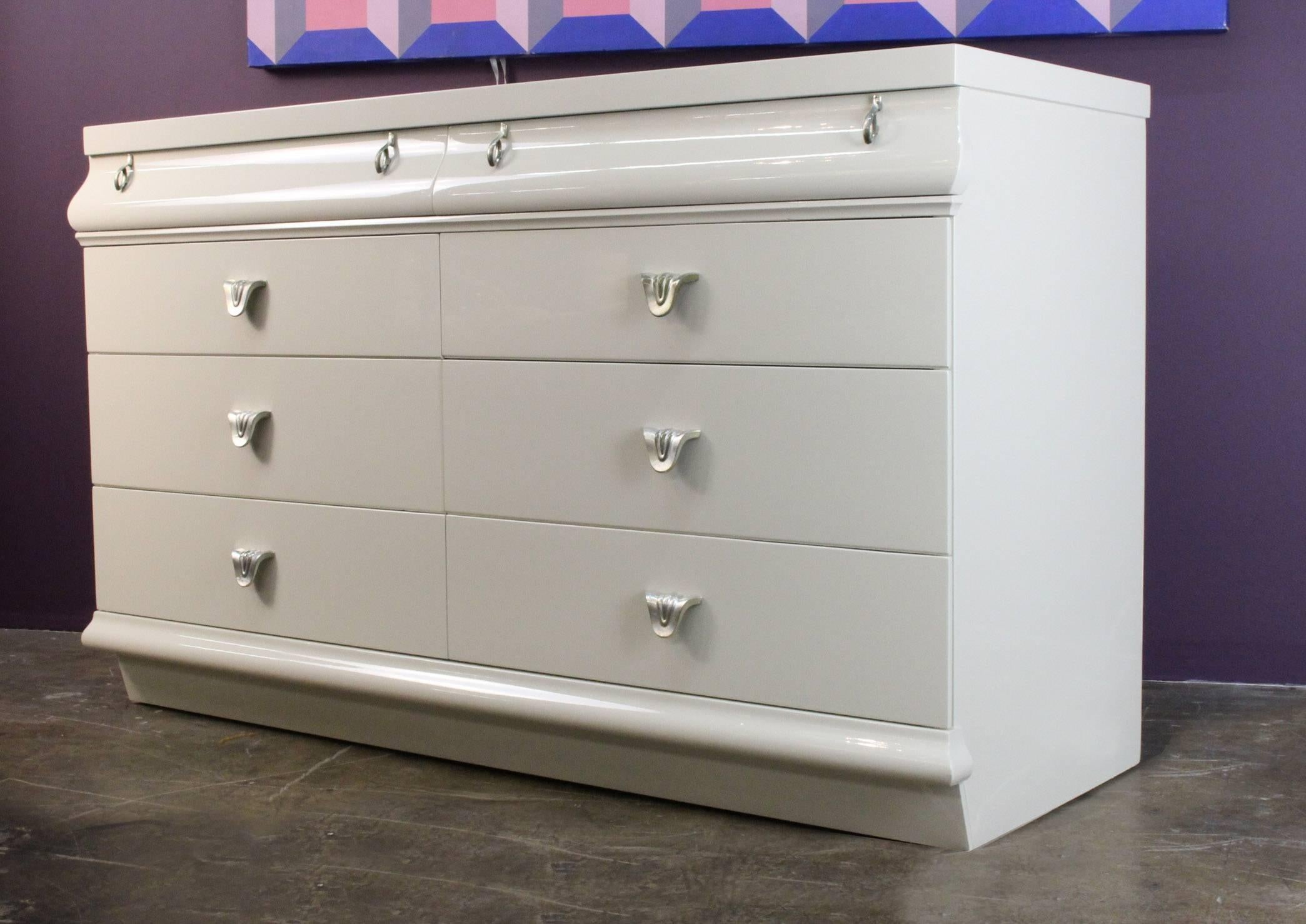 This chic dresser with great form is perfect for a small apartment or would go equally well in a baby room, this dresser has lovely proportions. The dresser has also been professionally lacquered.