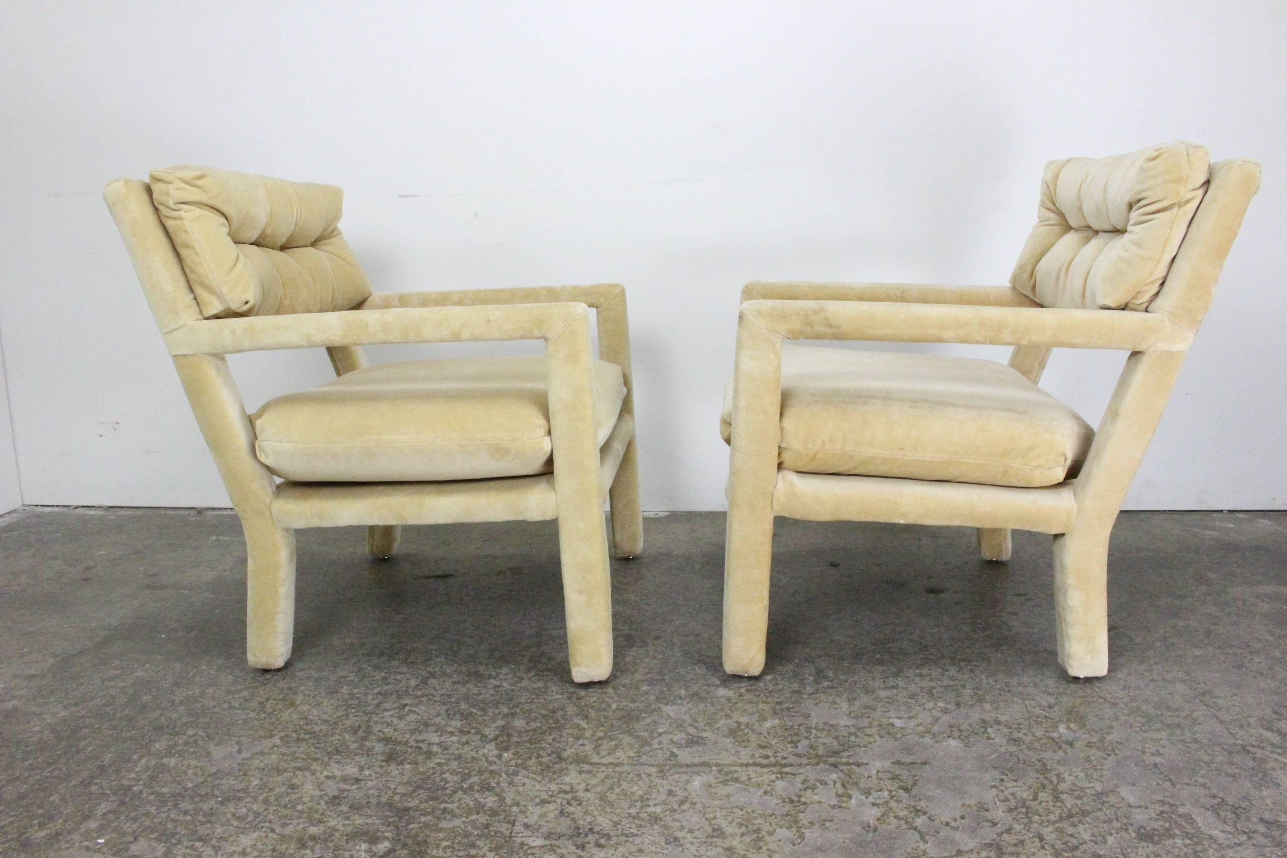 A wonderful pair of fully upholstered parsons chairs by Milo Baughman. Extremely comfortable with a mid scale, the chair do retain their original labels.