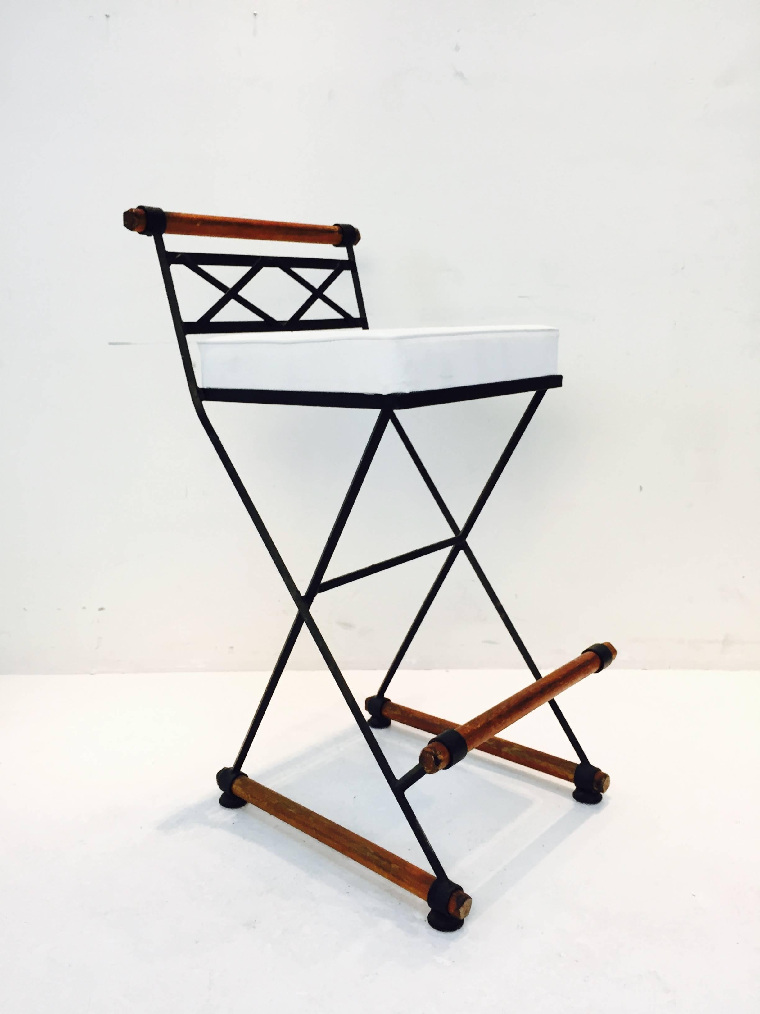 Steel stools with leather seat and oak rounds.