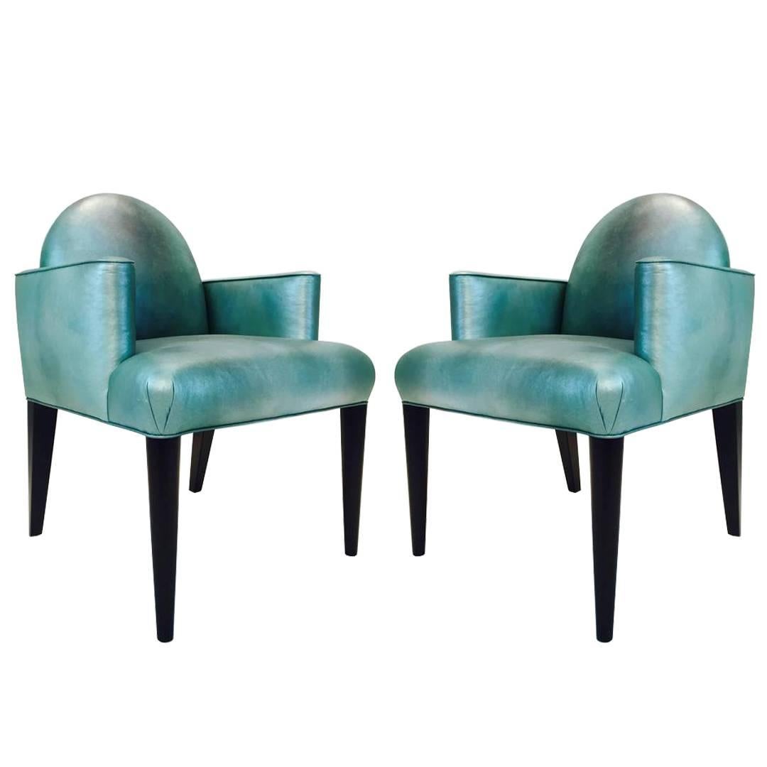 Donghia Luna Arm Dining Chairs. Retain Donghia label, ebonized legs, with original Edelman iridescent Leather. circa 1980s 

dimensions: 24"w x 23"d x 35"t
seat height 20"