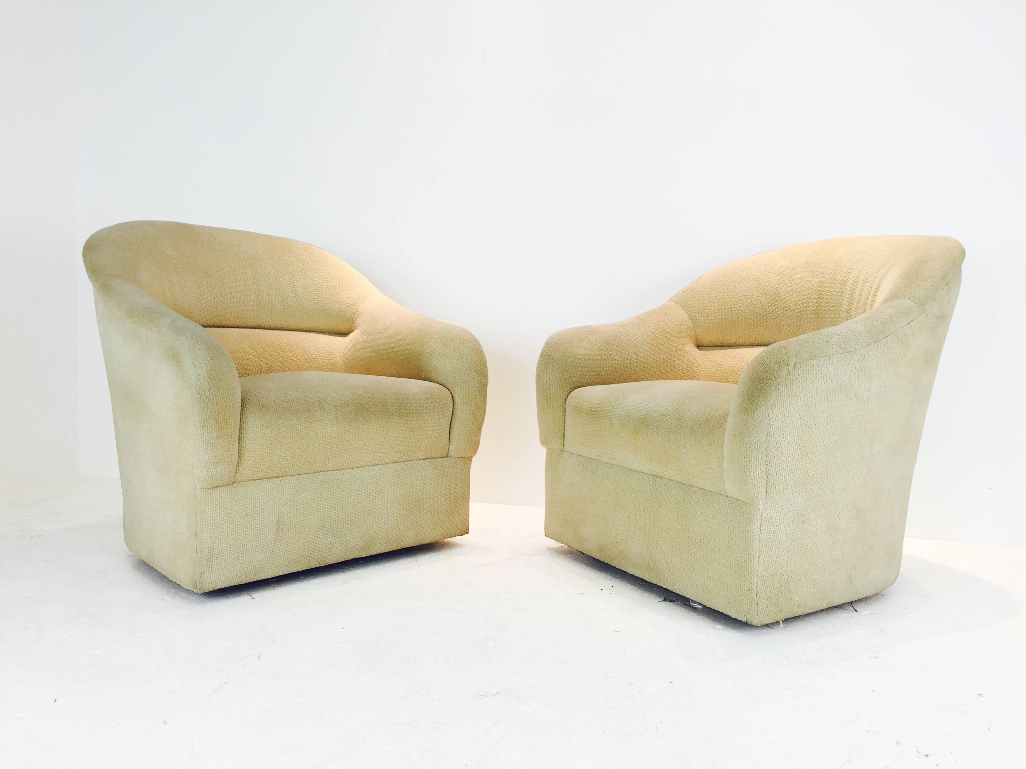 Pair of Ward Bennett barrel back club chairs. Original fabric. Reupholstery recommended. Wood legs.
