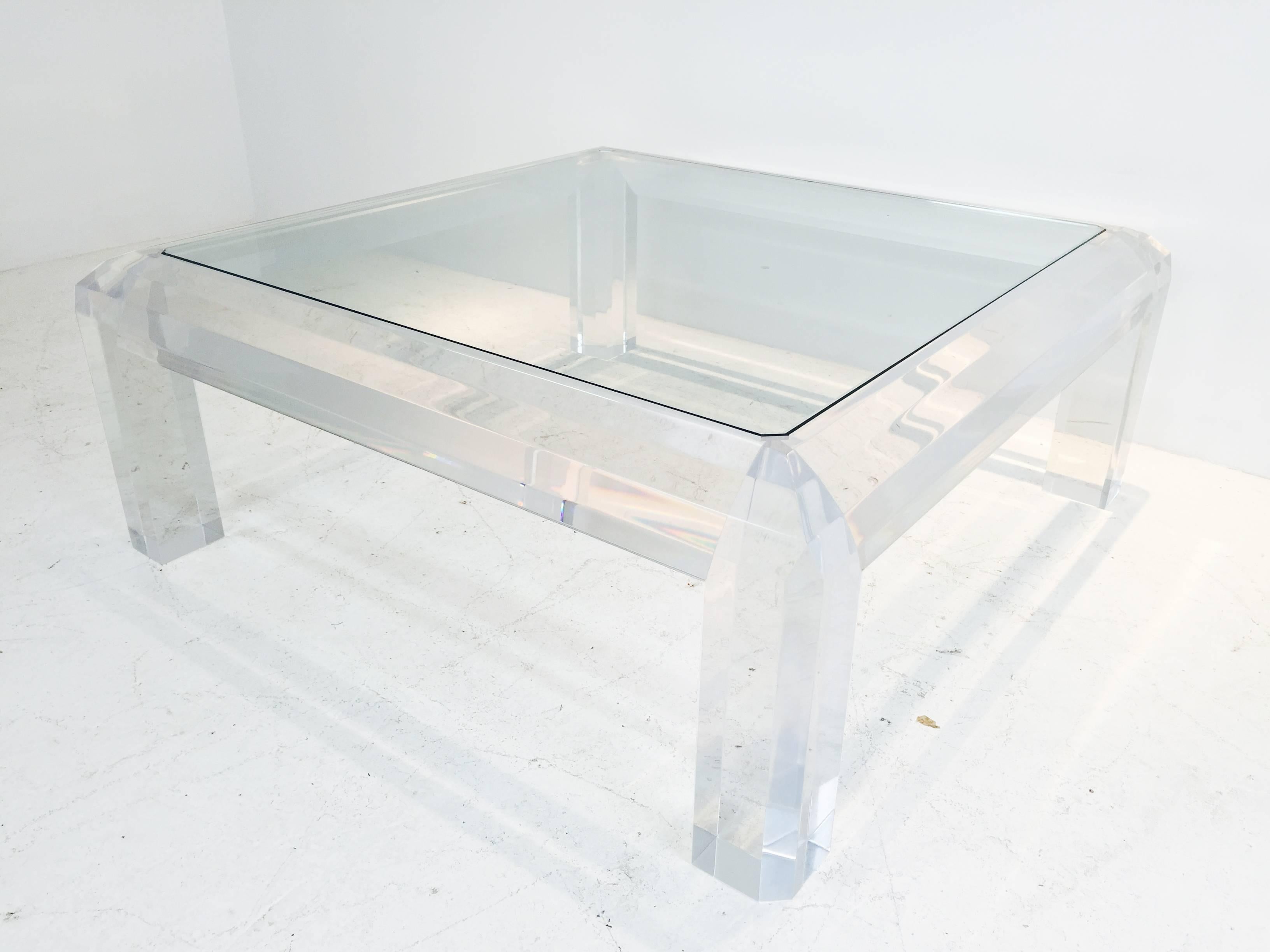 Gorgeous Lucite and glass coffee table.