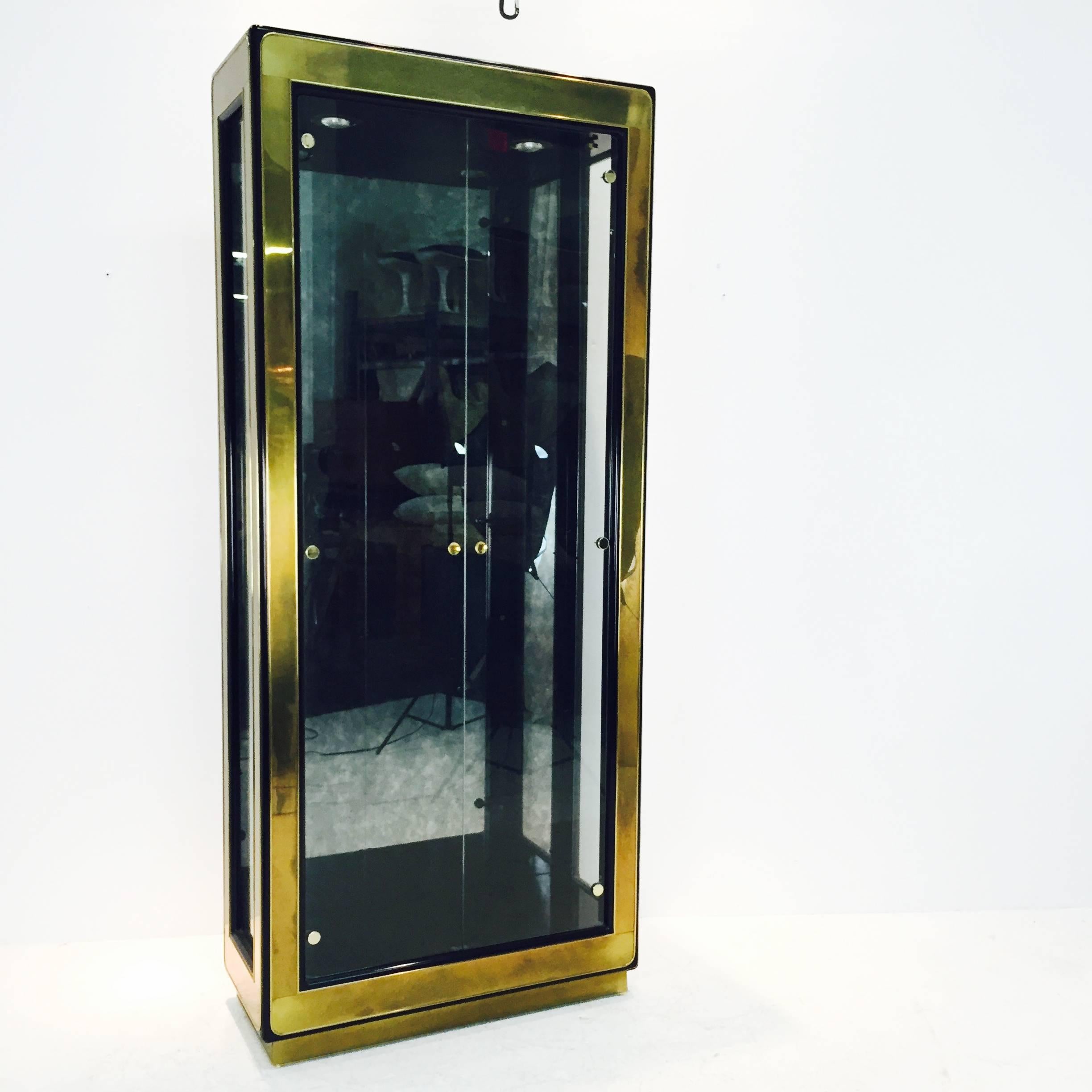 Brass and glass etagere by Mastercraft.

Dimensions: 36