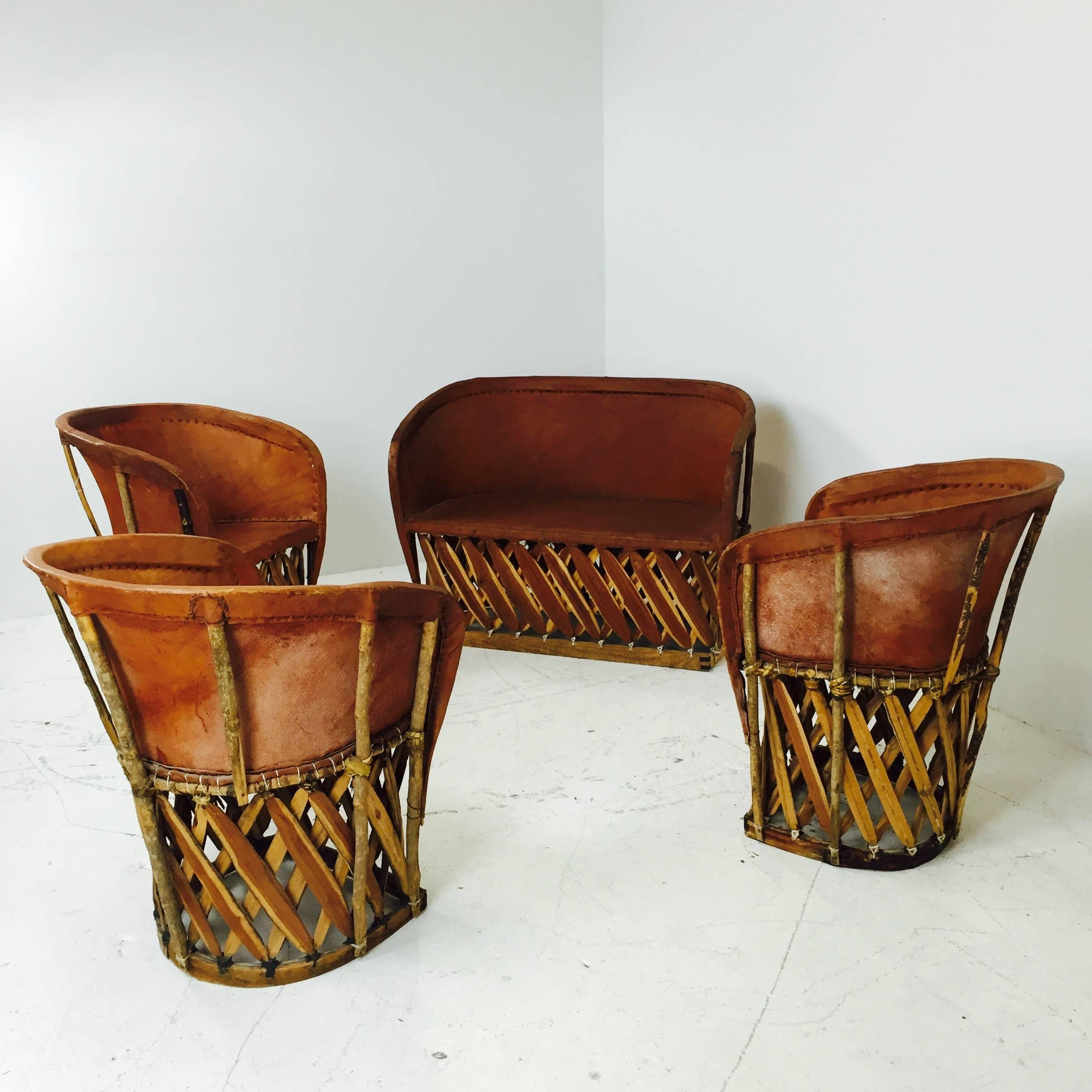 These chairs are handcrafted in Mexico from tobacco colored pigskin and cedar. This set has a settee and three armchairs. Perfect for indoor or covered outdoor living.

Dimensions: 44