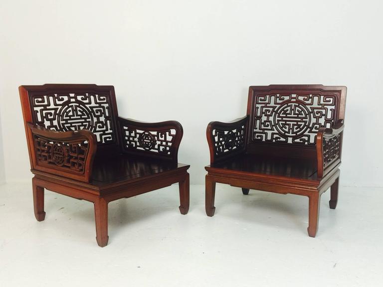 Pair of Carved Chinese Art Deco Cherrywood Lounge Chairs For Sale at