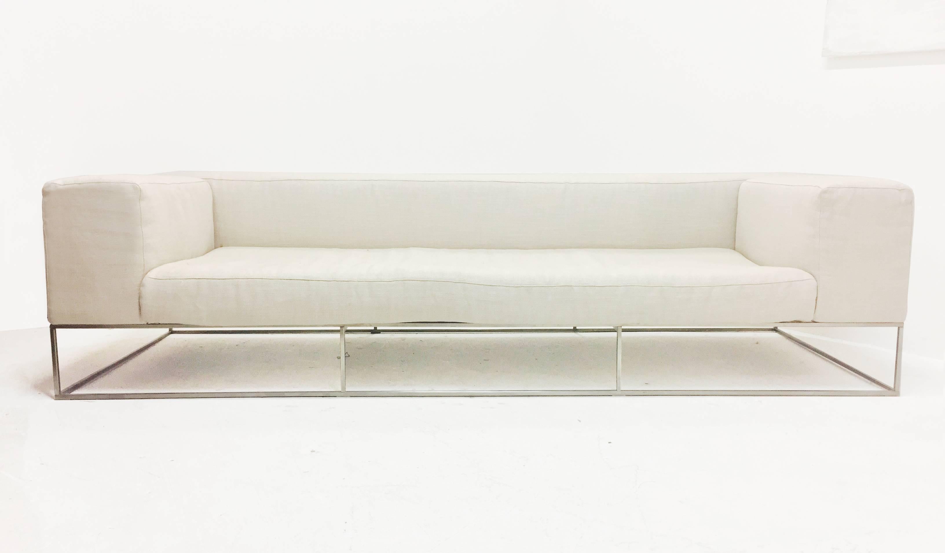Ile club sofa by Piero Lissoni for Living Divani. Perfect sofa for style and comfort. New upholstery is recommended, there is some fading on backrest. The frame is constructed of square tubular polished steel, circa 2003.

Dimensions: 98 x 37 x 25