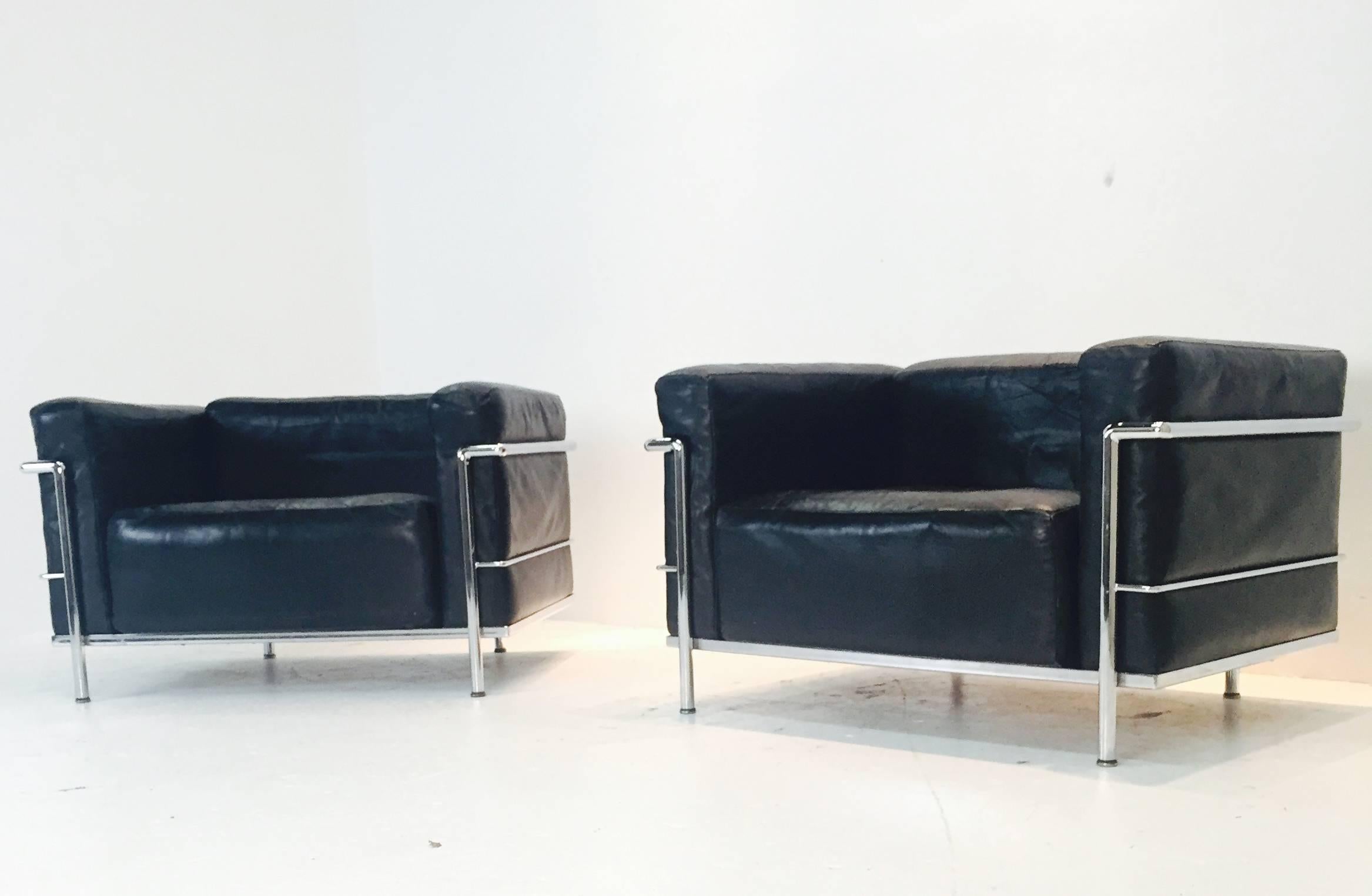 Pair LC-3 grand comfort lounge chairs by Le Corbusier. The leather seating has an aged look. The chairs are in good vintage condition with appropriate wear due to age. These chairs were made in the 1960s for Cassina originally designed in 1928