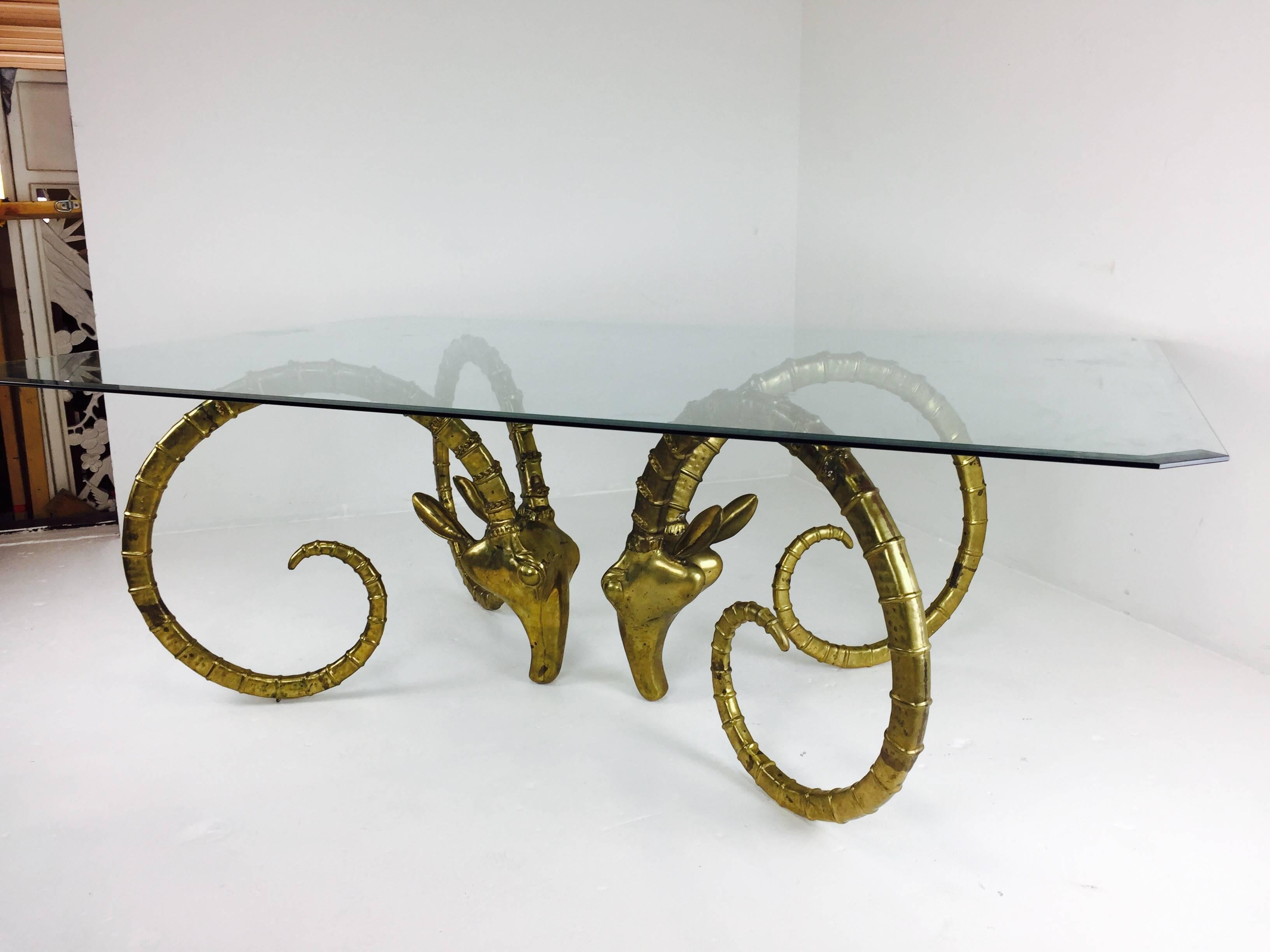Brass ram's head or ibex dining table. Brass does have an aged patina to it. 

Dimensions: 84" L x 60" W x 29" T.
 