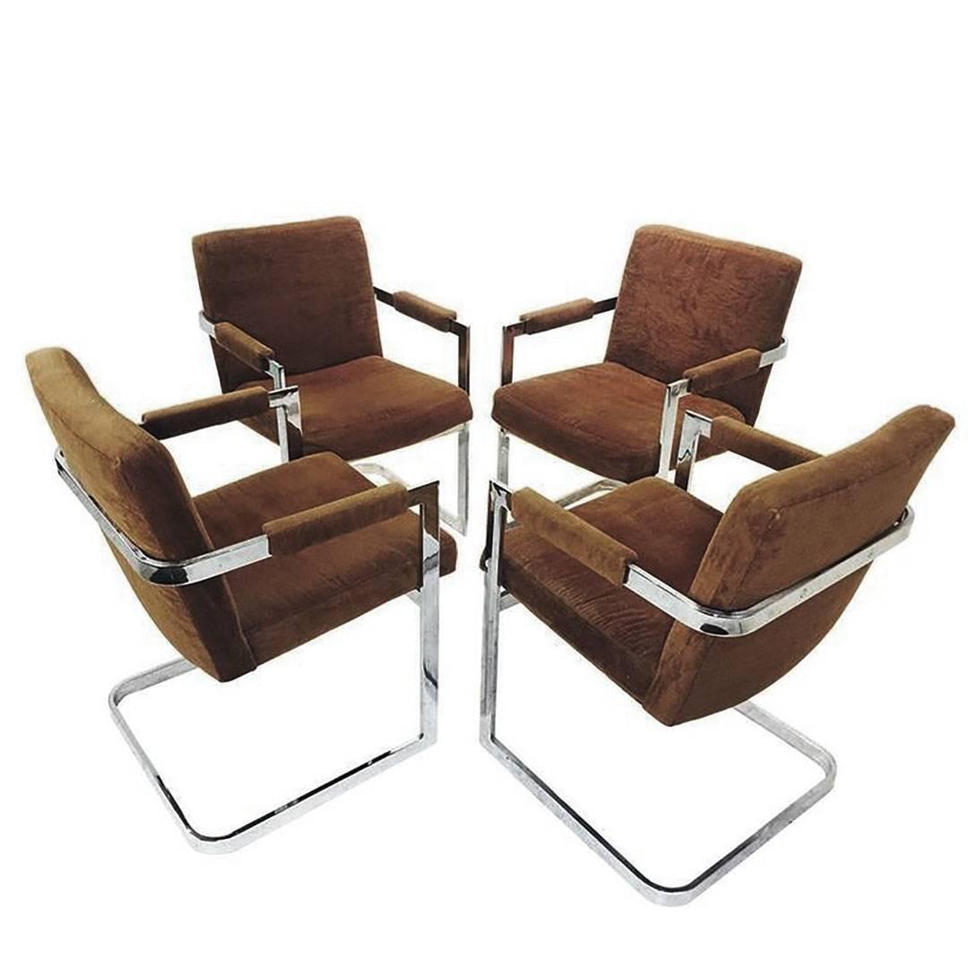 Set of four Milo Baughman chrome cantilever dining chairs. Brown velvet is original, circa 1970s.

Dimensions: 23
