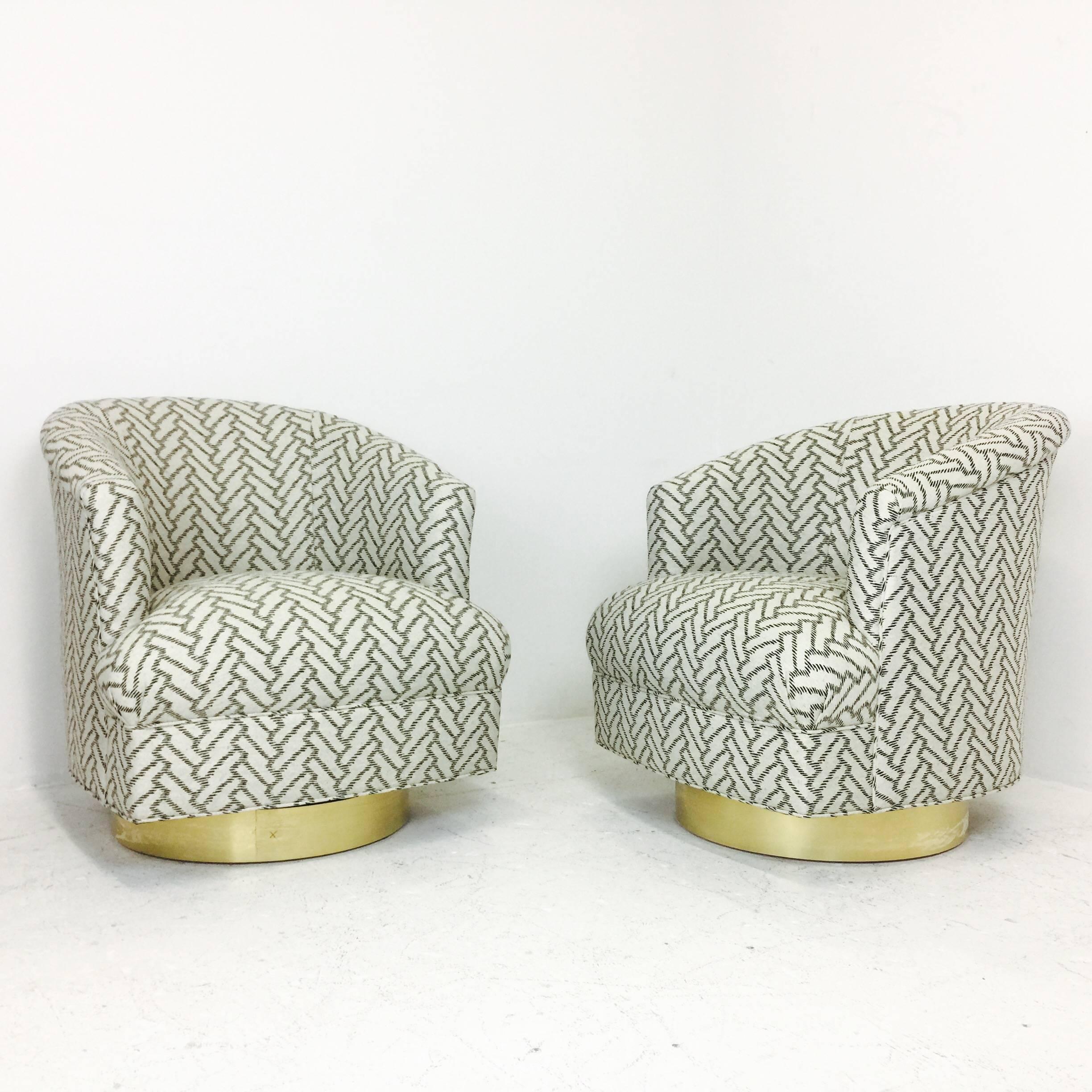 These stunning swivel chairs were newly upholstered in a white and black herringbone pattern and new bronze plinths were added for touch of glamour.

Dimensions: 29