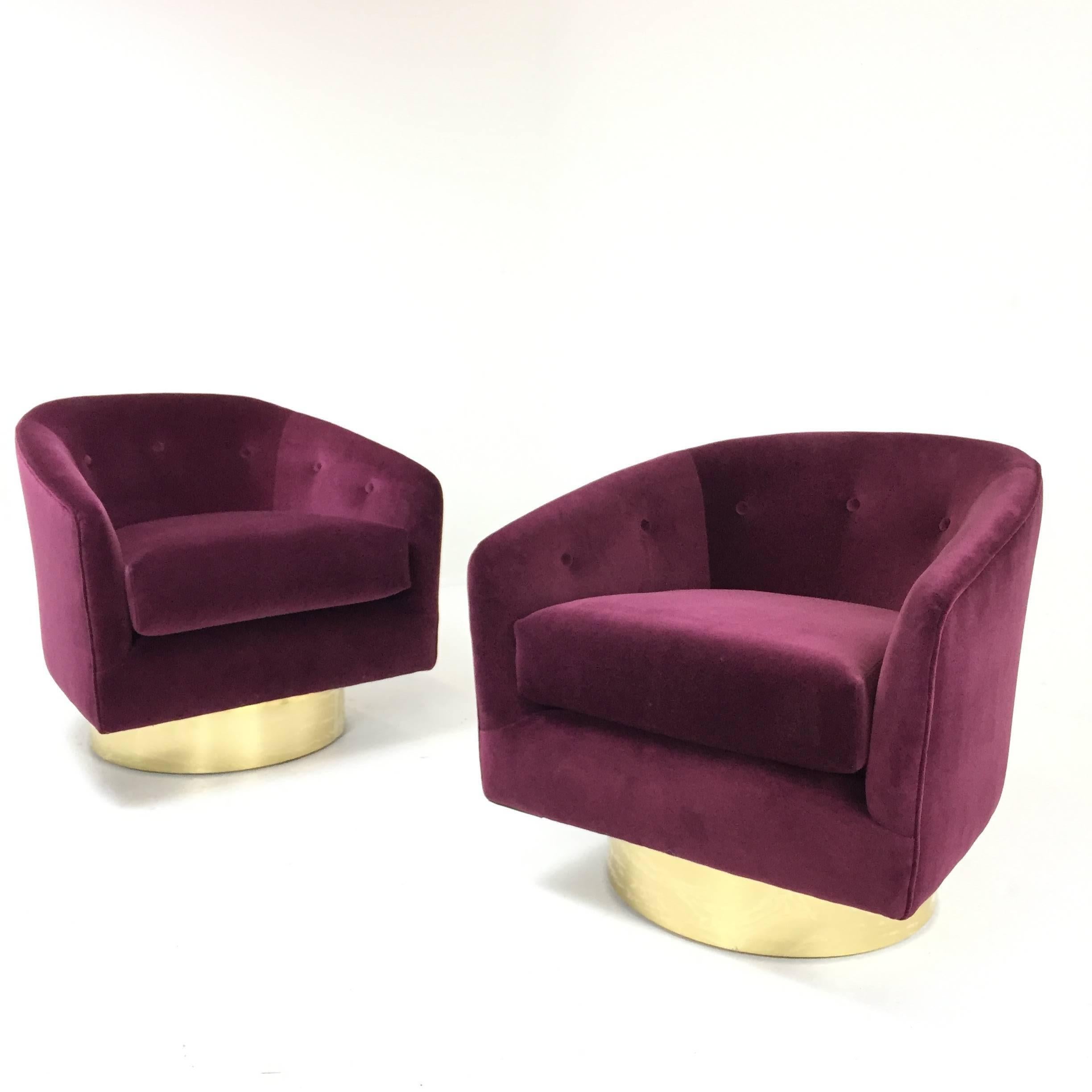 Milo Baughman swivel chairs reupholstered with gorgeous merlot velvet and our custom brass plinths. The brass can be 