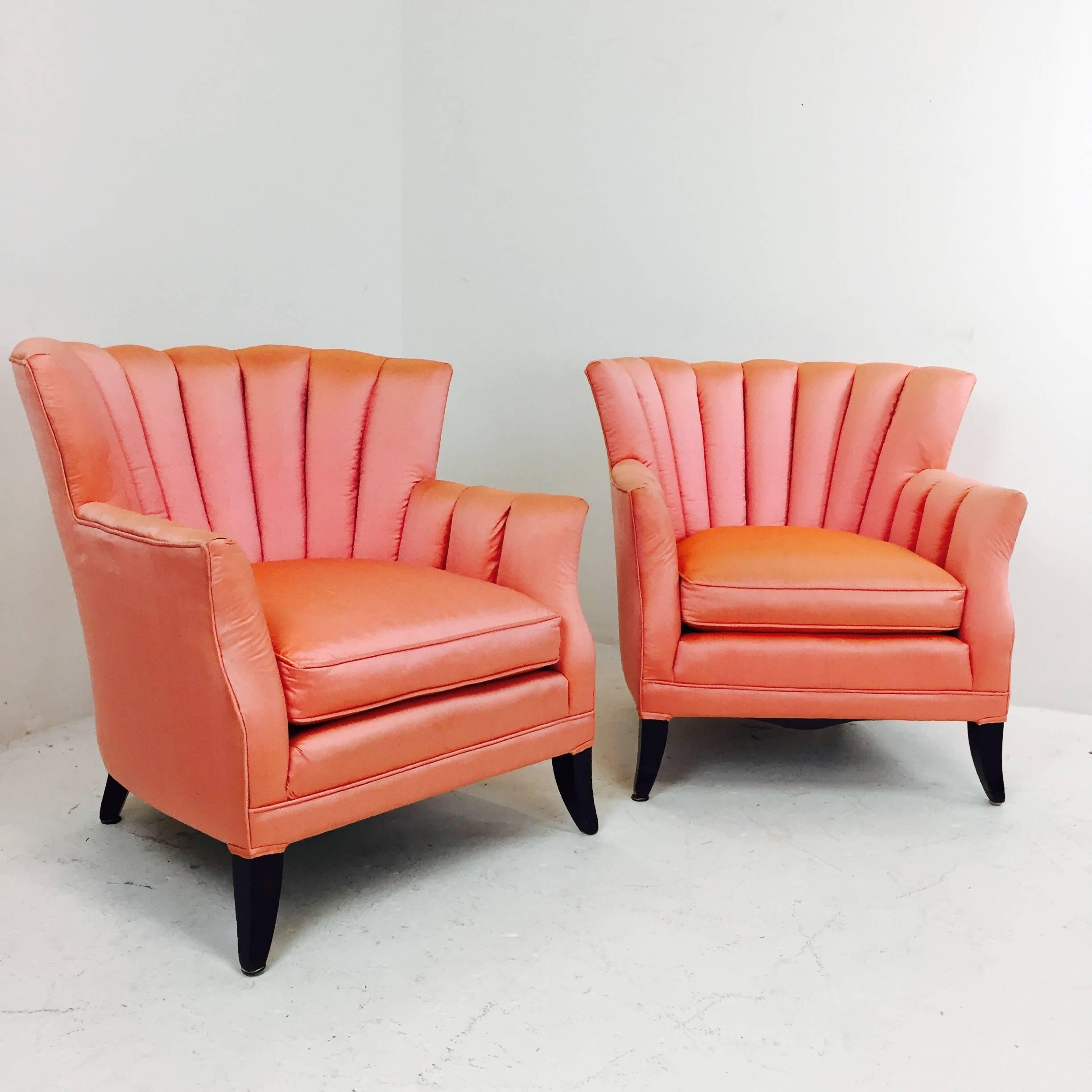 Pair of coral silk channel back Regency armchairs. In good vintage condition but new upholstery is recommended, circa 1960s.

Dimensions: 34" W x 33" D x 32" T,
seat height 18".