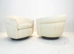 Pair of Milo Baughman Side Channel Swivel Chairs with Wood Plinth Base