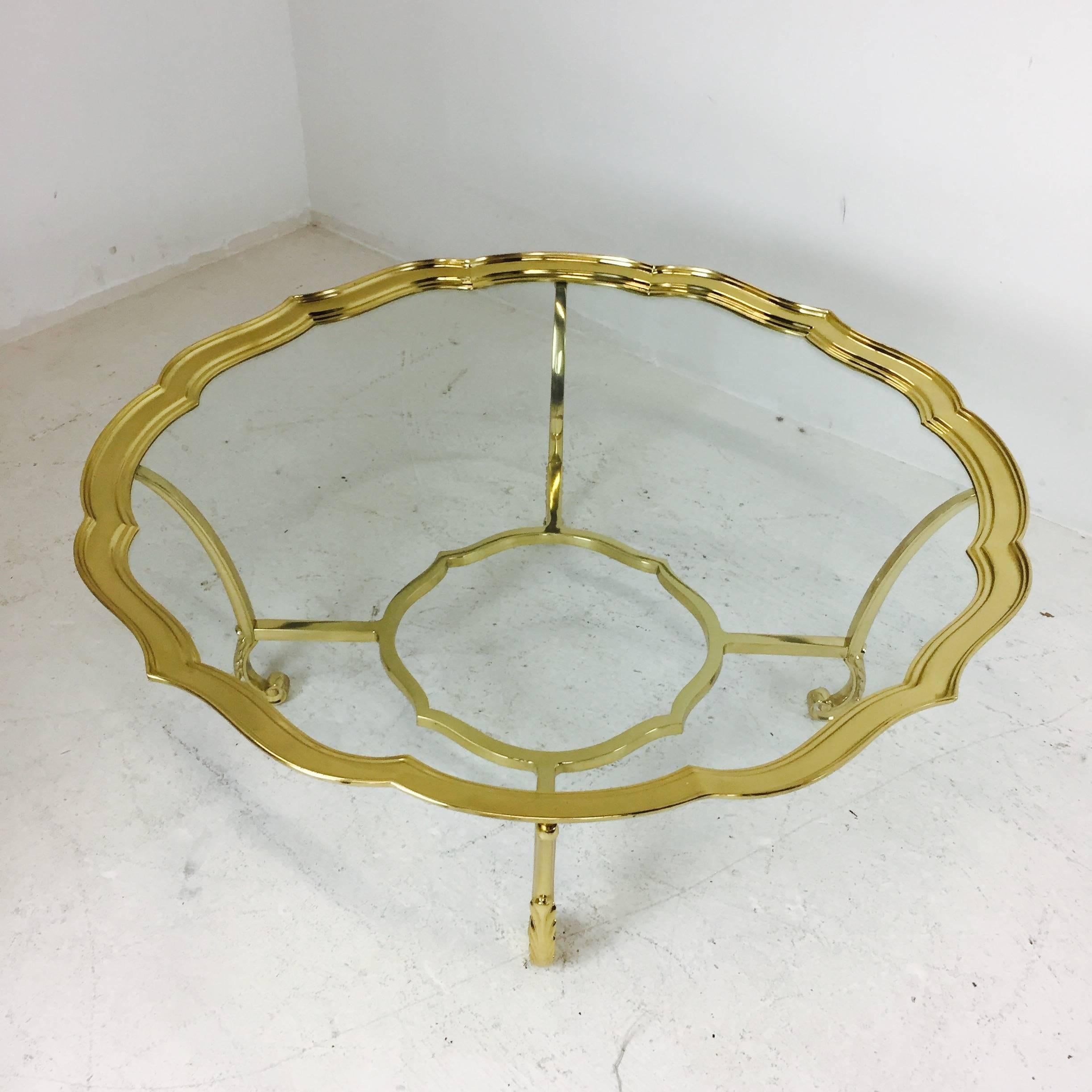 Hollywood Regency scalloped edge brass and glass coffee table by Labarge. The table is heavy in weight and has minimal wear to finish. 

Dimensions: 41.5" D x 16" T.
