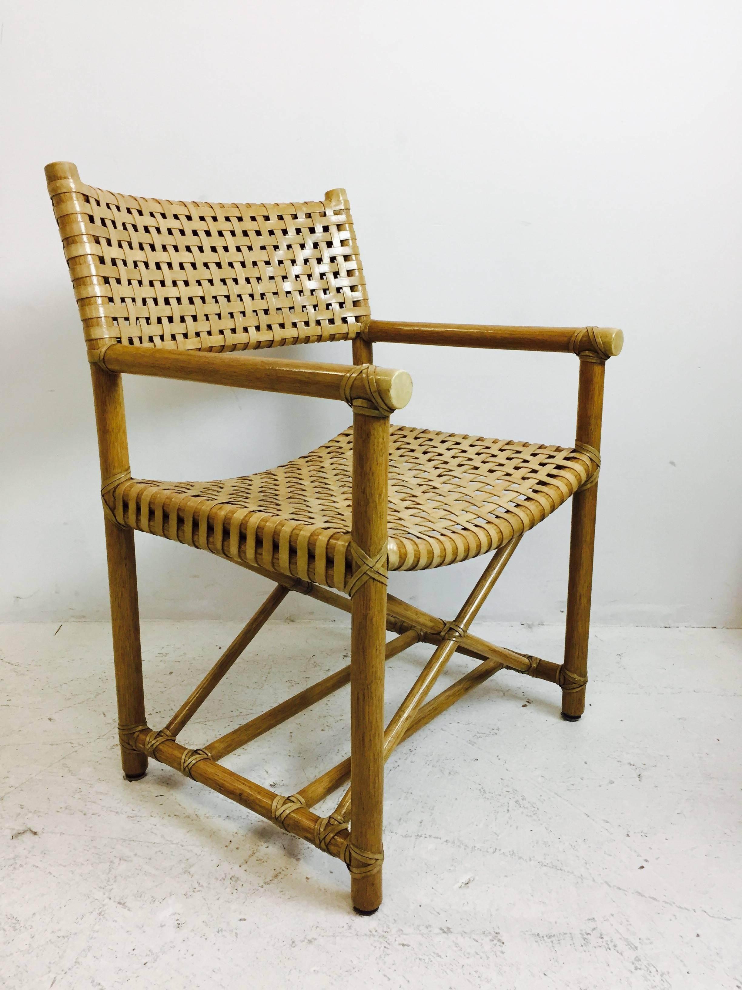 Set of five rattan dining chairs by McGuire. Directors style chairs with X-shaped stretchers. These chairs do need refinishing, circa 1960s.

See our other listing for the McGuire dining table

Dimensions: 22.5" W x 22" D x 34" t
seat