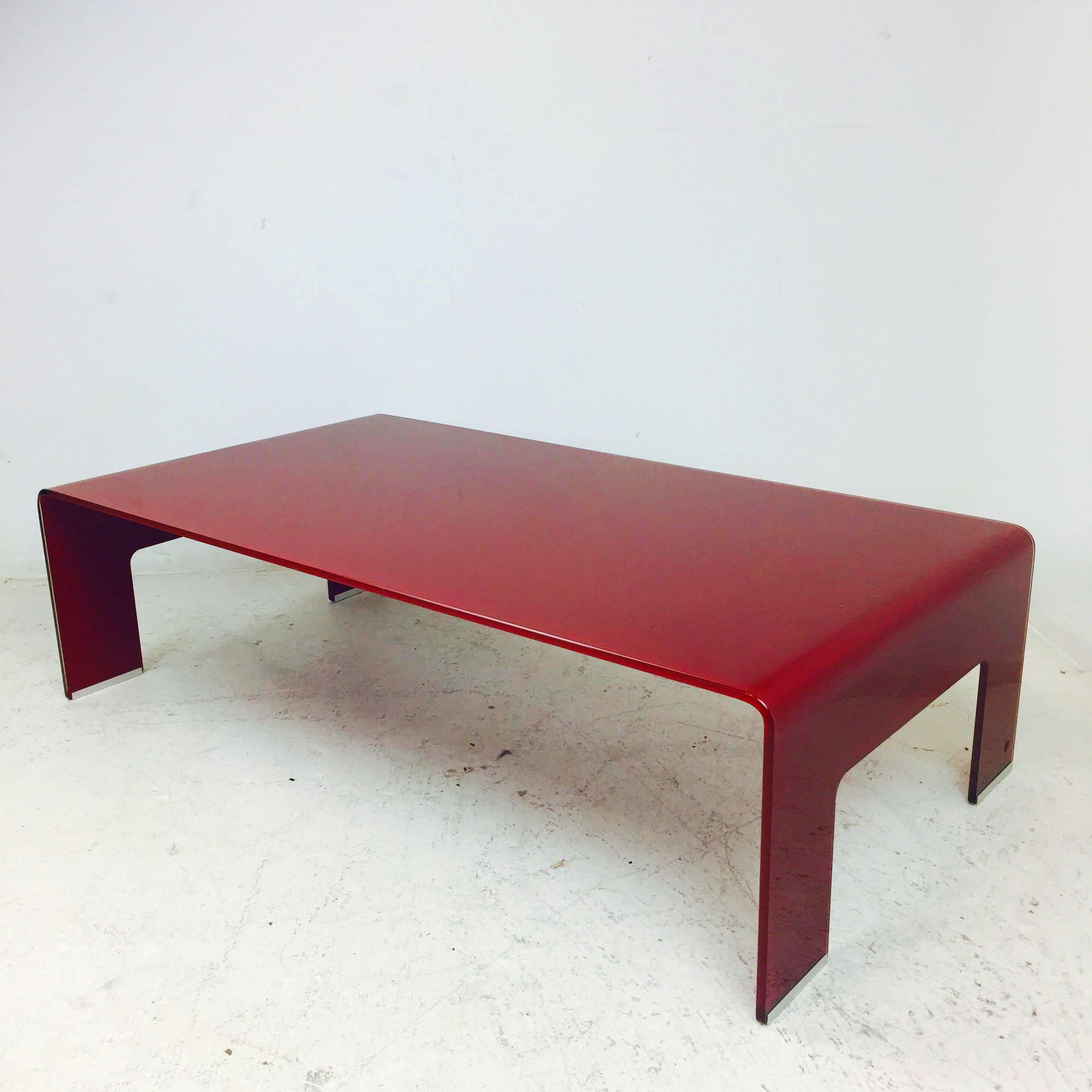 Calligaris 1923 red glass waterfall coffee table.

Dimensions: 46" W x 26.5" D x 13" T.
