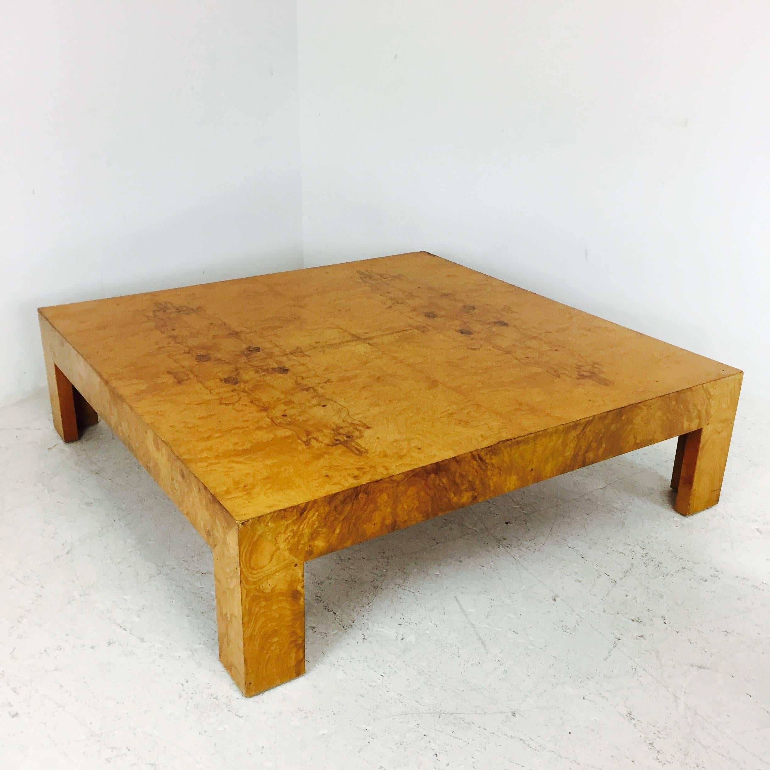 Milo Baughman burl wood coffee table with beautiful matchbook burl veneers. Has recently been refinished. Labeled, circa 1970s

dimensions: 54" wide 54" deep 15" tall.