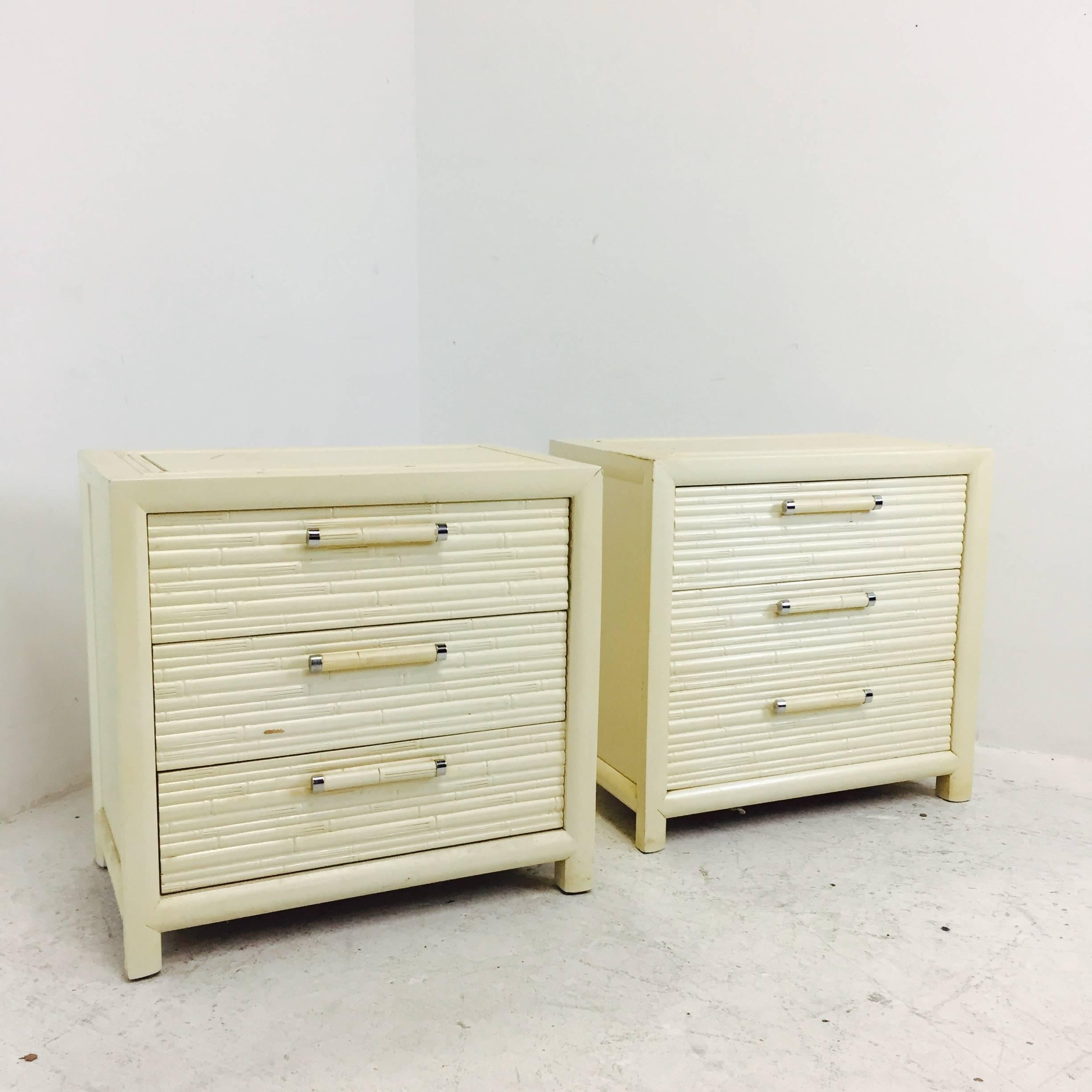 Pair of faux bamboo nightstands by Century. There is visible wear on the nightstands. New lacquer is all these guys need to be updated, circa 1960s.

dimensions: 26