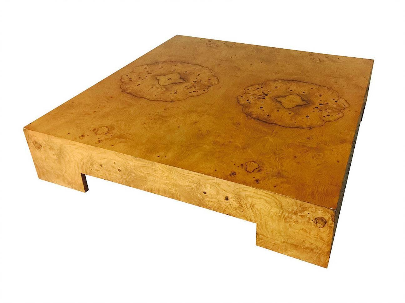 Burl wood parson style coffee table by Milo Baughman. Refinishing is recommended, circa 1970s

Dimensions: 48" W x 48" D x 10" T.