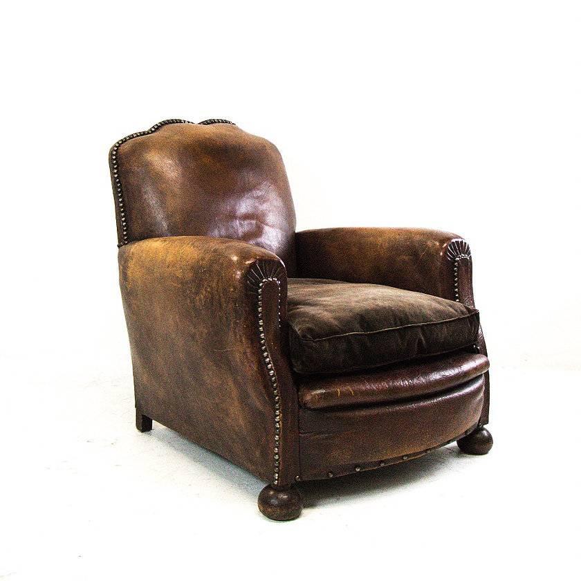 Pair of vintage cognac leather club chairs with velvet seat cushions. Leather has a warm aged patina, circa 1930s

Dimensions: 24" W x 30" D x 34" T
seat height 16".