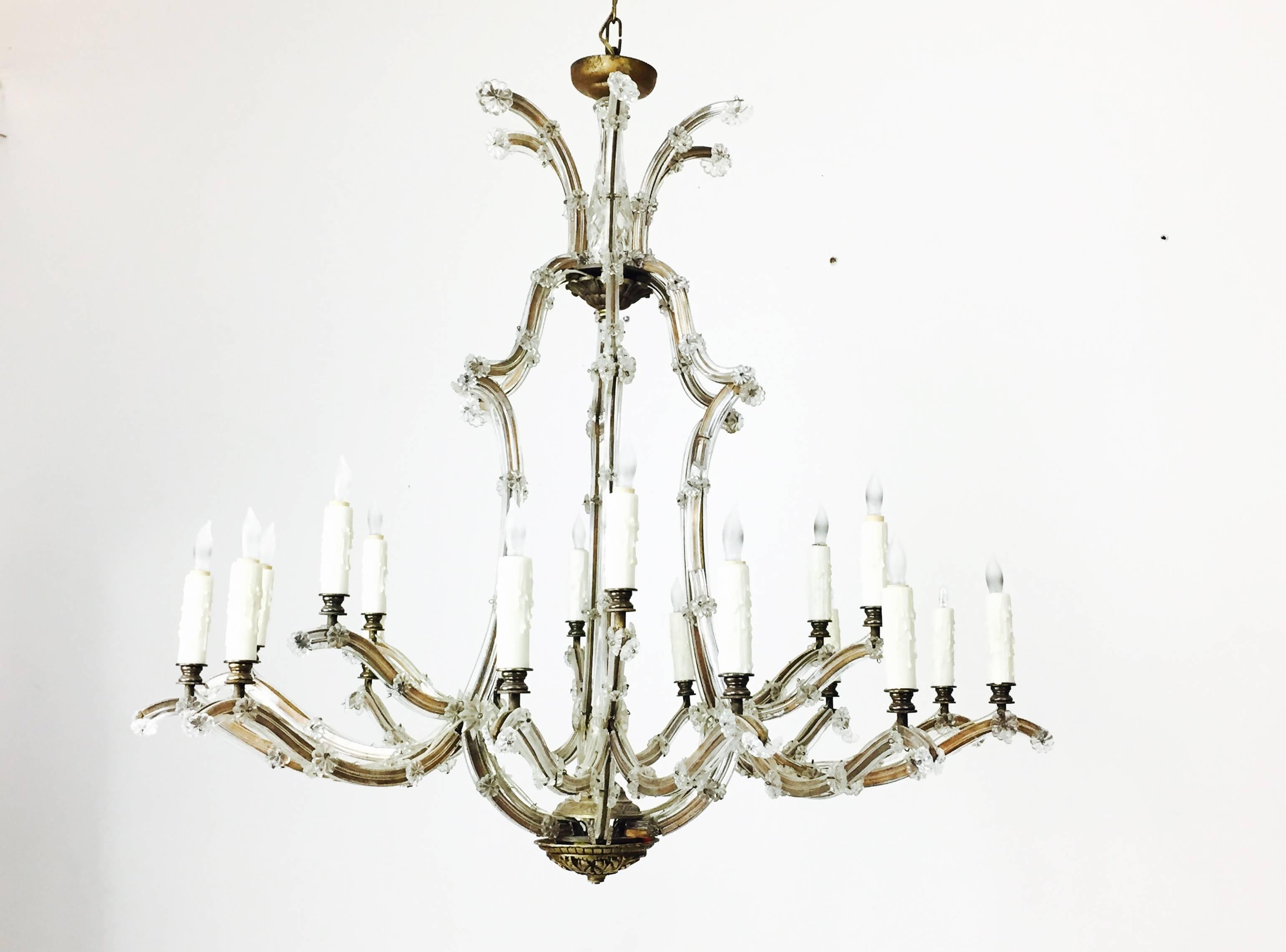 Maria Theresa gold and silver crystal chandelier. In good vintage condition with some breaks in the crystal.

Dimensions: 39