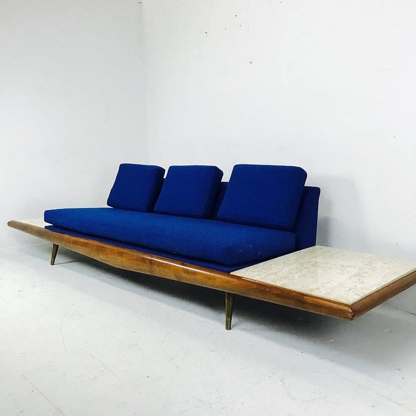 Adrian Pearsall sofa with built-in travertine side tables. In good vintage condition with signs of wear from use and age. Original upholstery, circa 1960s.
 
One sofa available

Dimensions: 117.5