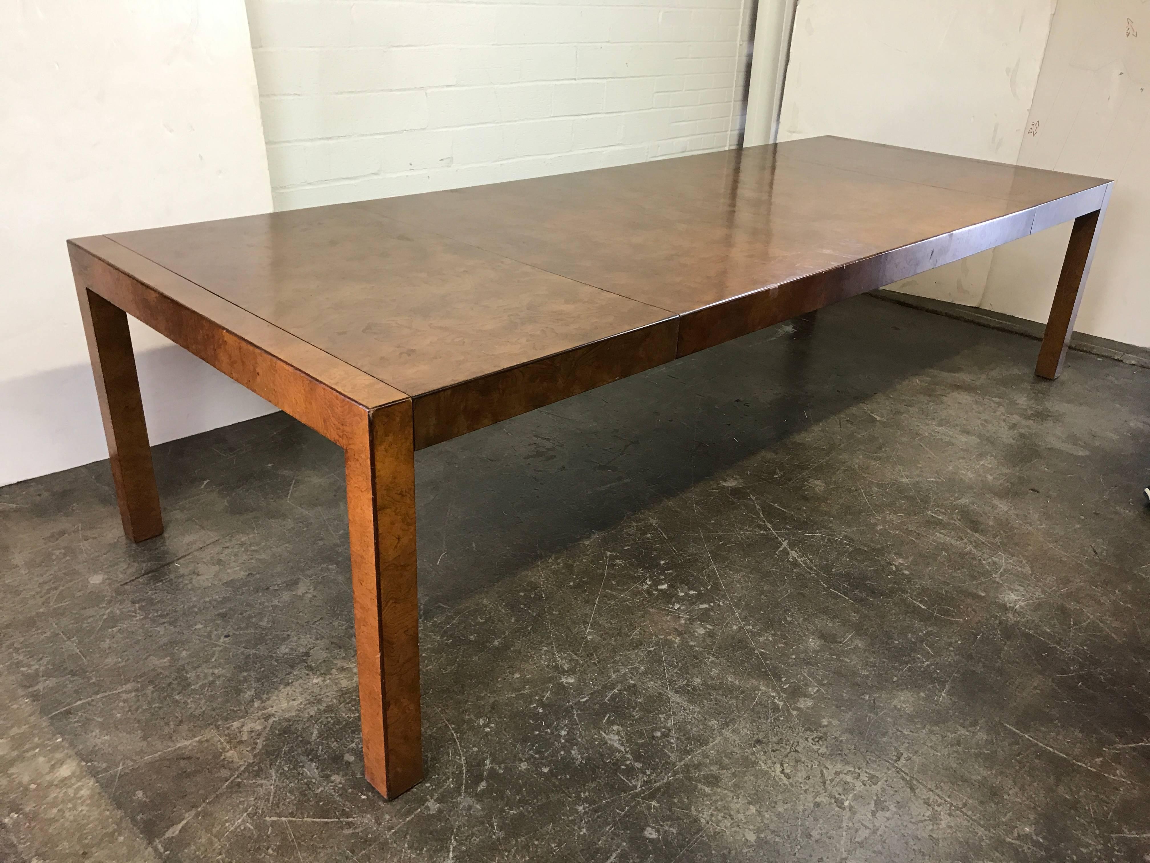 Burl wood Parsons style dining table by Widdicomb. In good found condition with wear due to age and use. Refinishing is recommended, circa 1970s

Dimensions: 120" W x 43" D x 29.5" T fully extended with two 24" leaves.