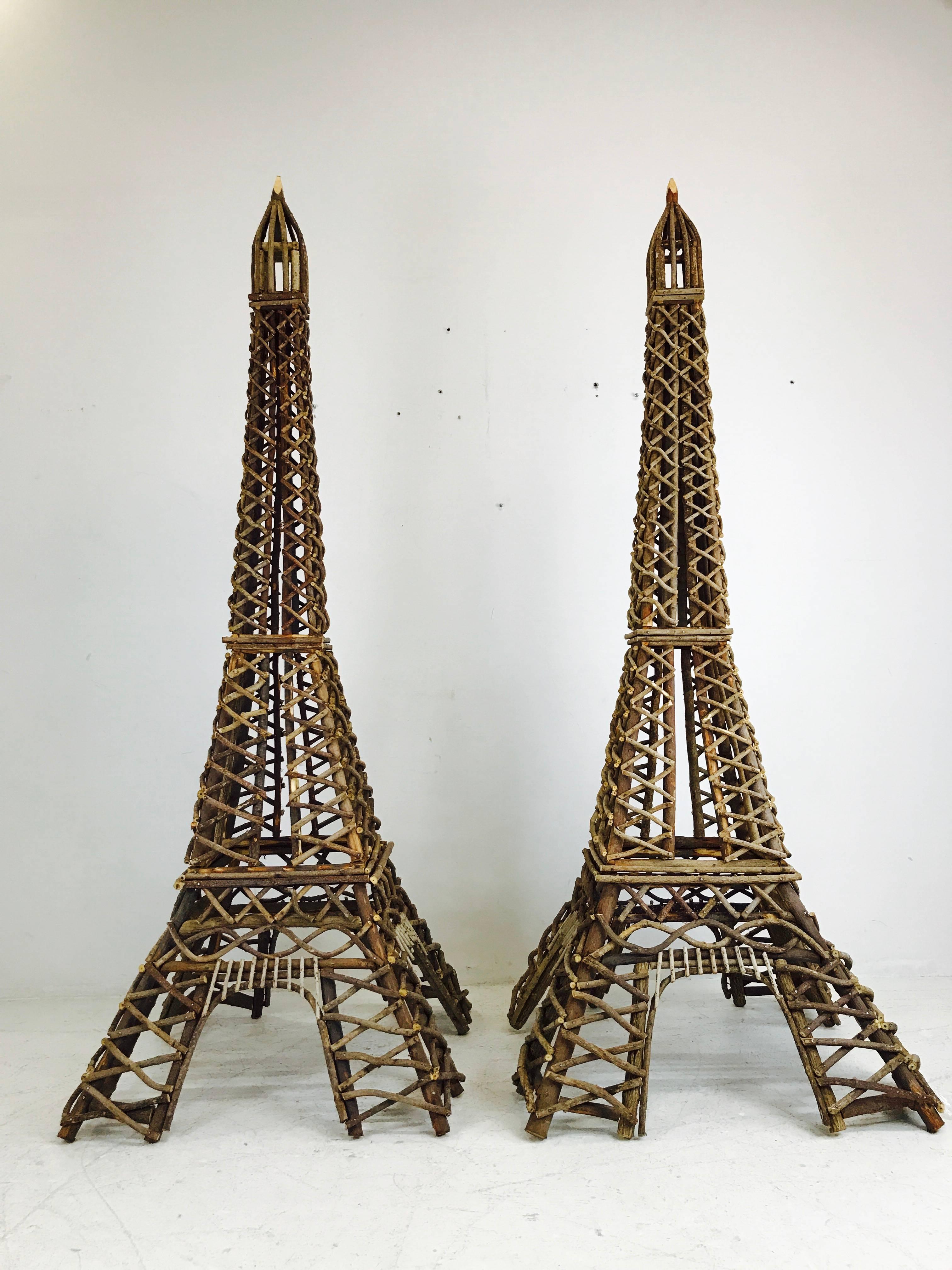 Pair of Eiffel tower twig sculptures.

Dimensions: 33